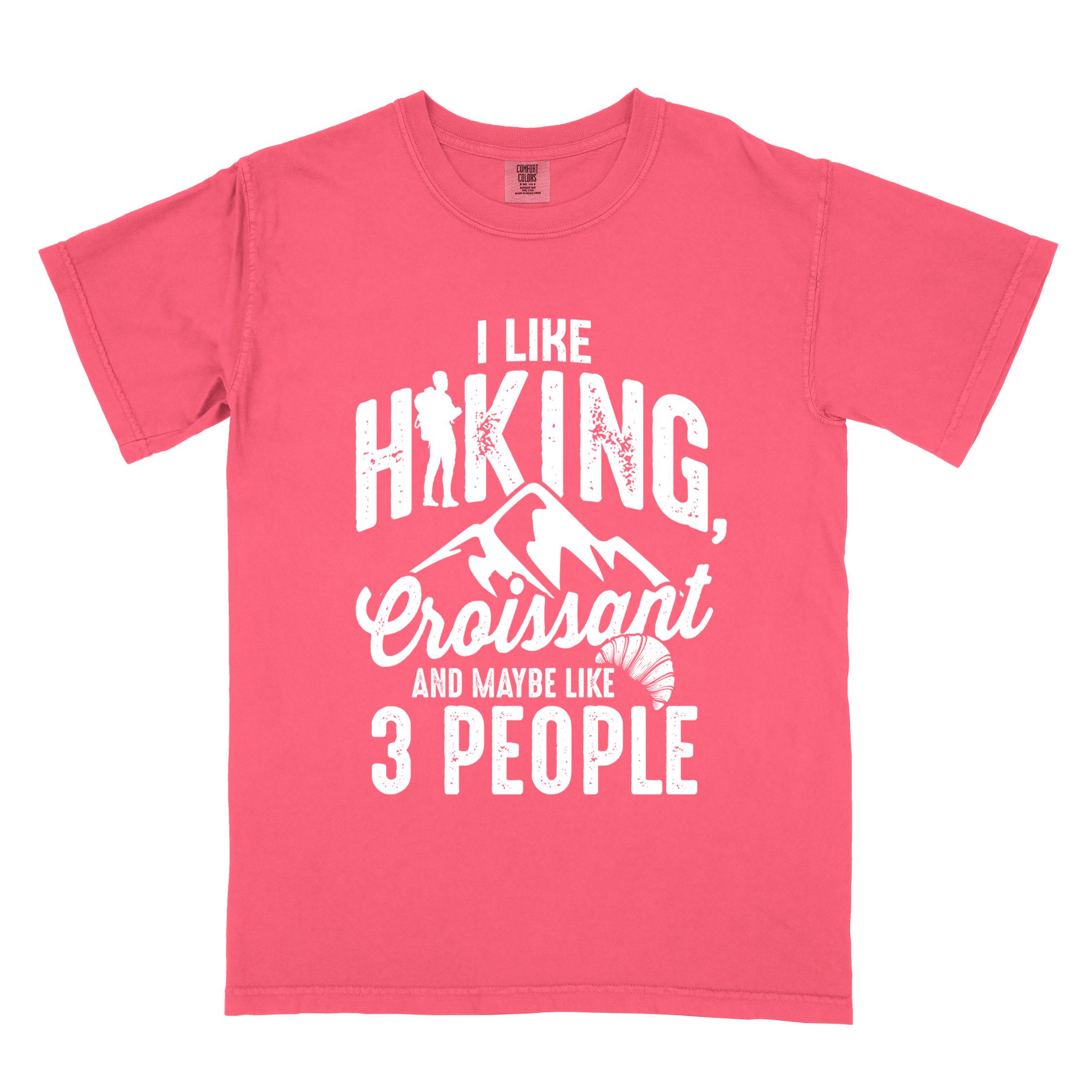 Watermelon "I Like hiking, croissant and maybe like 3 people" colored vintage tee with bold typography, birds, mountains, illustrated croissant, and backpacker for pastry enthusiasts.