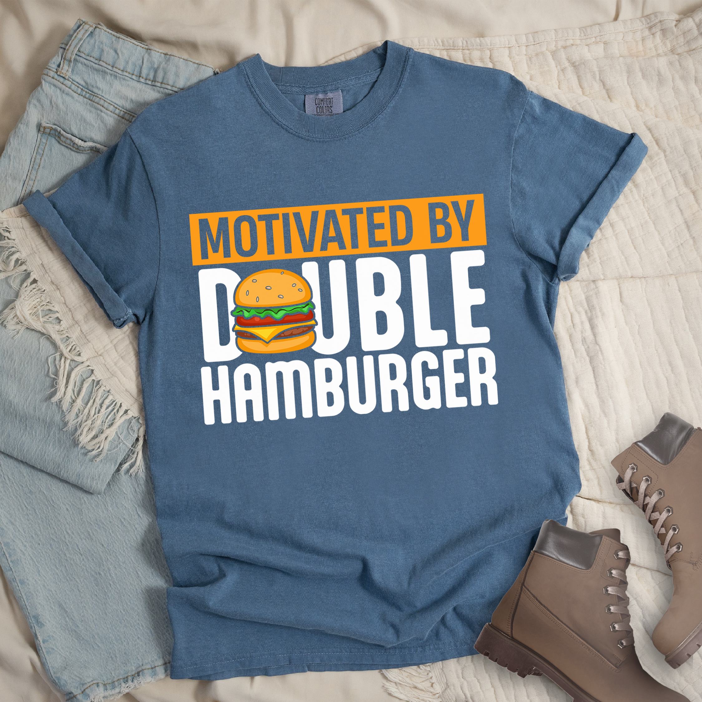 Dark blue shirt with Hiking Design featuring the phrase “Motivated by Double Hamburger” and an illustration of a cartoon-style double hamburger between the words.