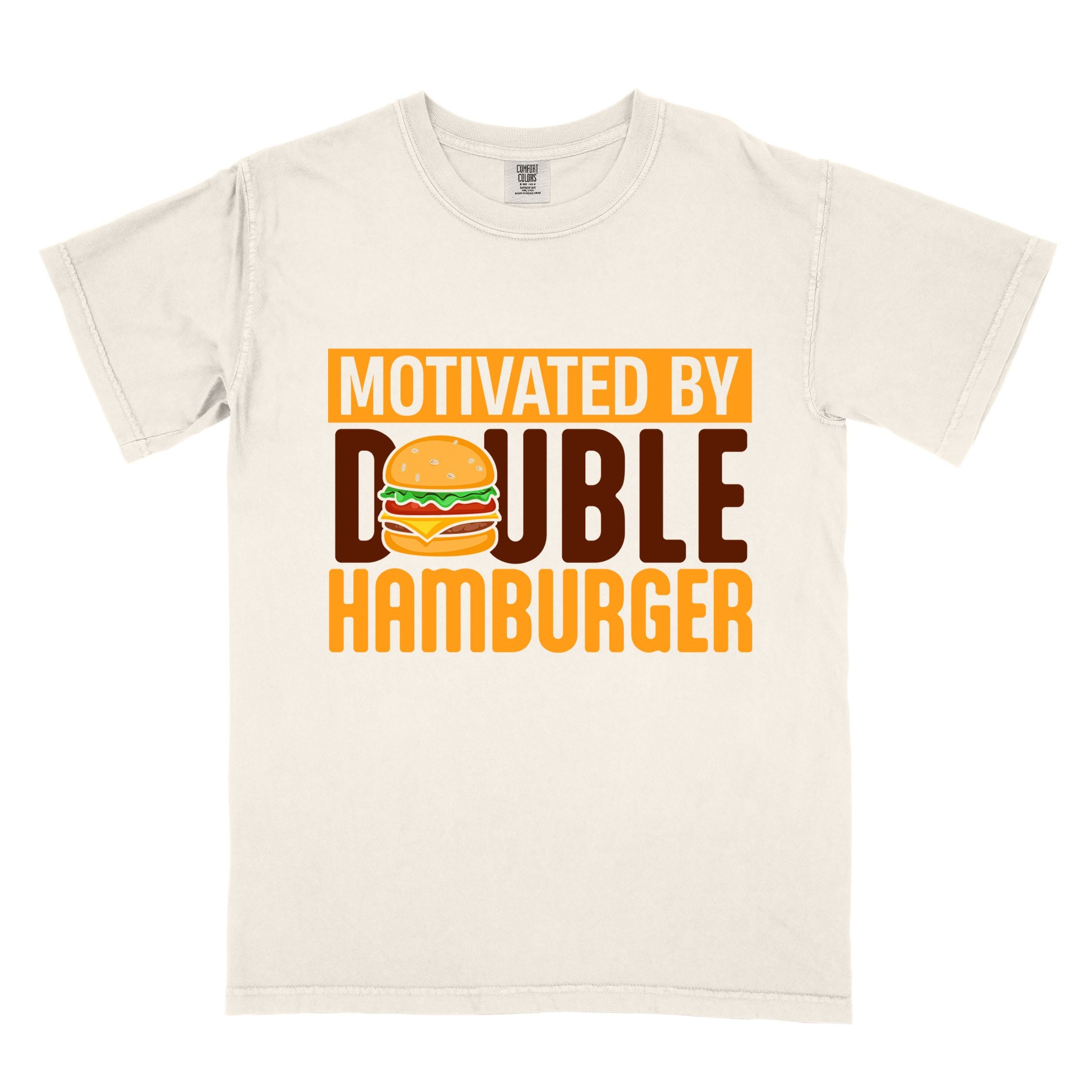 Ivory "Motivated by Double Hamburger" colored vintage tee with bold typography, illustrated juicy hamburger, and backpacker for burger enthusiasts.