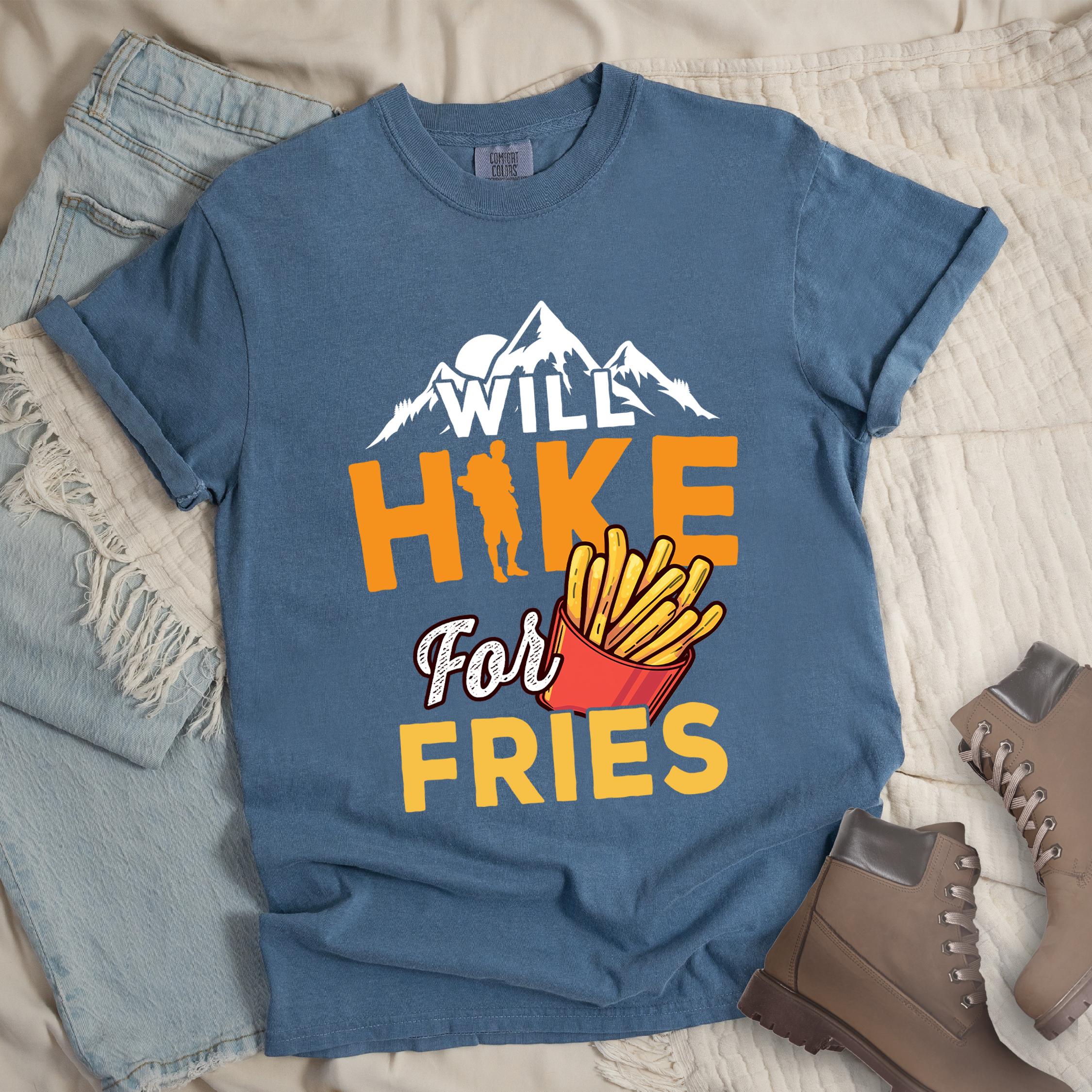 Dark blue shirt with Hiking Design featuring the phrase “Will Hike for Fries” and an illustration of a red fries container below a mountain outline and hiker silhouette.