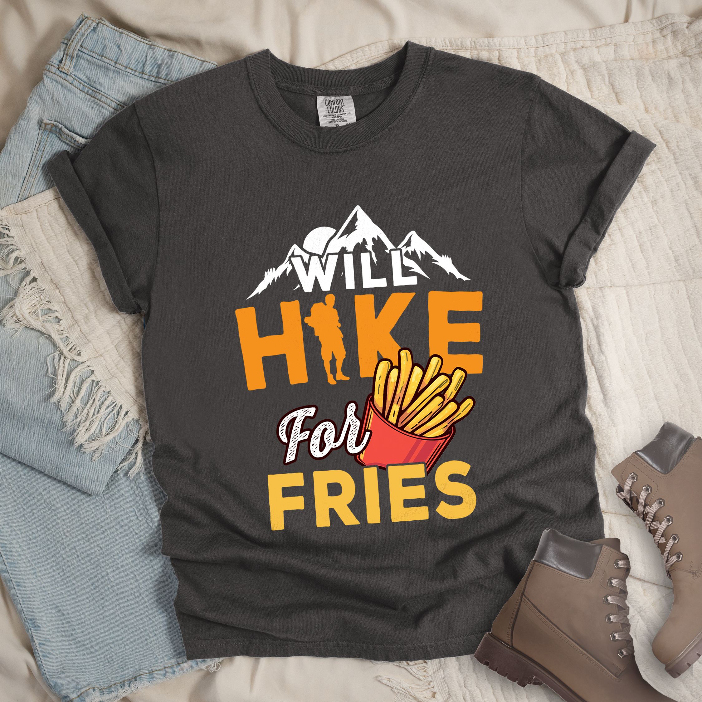 Dark grey shirt with Hiking Design featuring the phrase “Will Hike for Fries” and an illustration of a red fries container below a mountain outline and hiker silhouette.