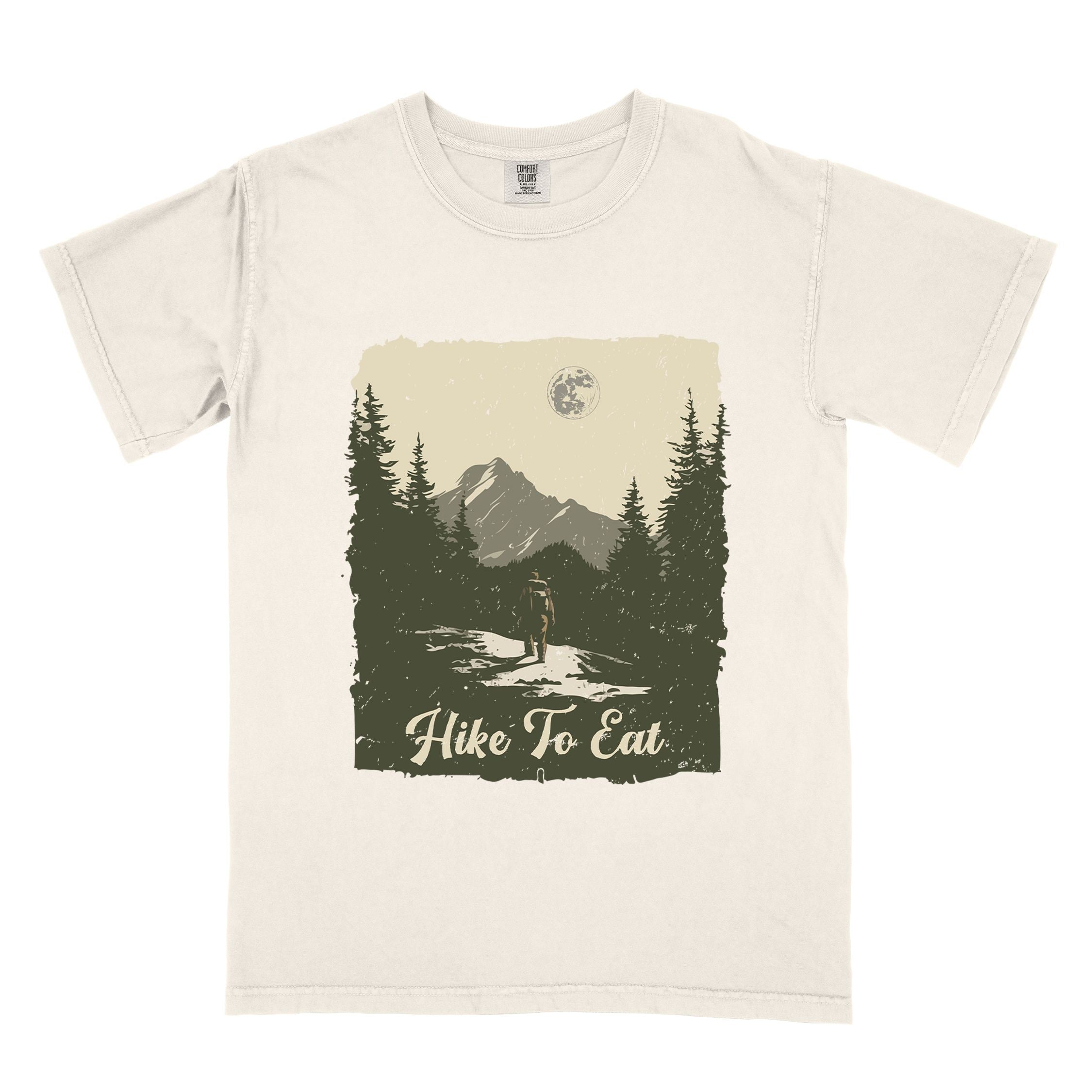 Ivory "Hike to Eat" colored vintage tee with bold typography, illustrated landscape, and backpacker for burger enthusiasts.