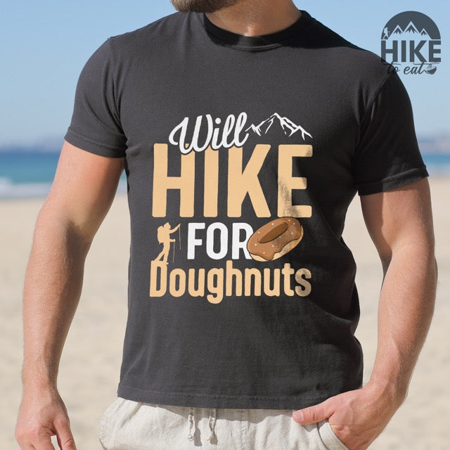 Black Will Hike for Doughnuts statement t-shirt featuring chocolate doughnut graphic, mountain peaks, and hiker silhouette for doughnut lovers and outdoor enthusiasts on Comfort Colors 1717