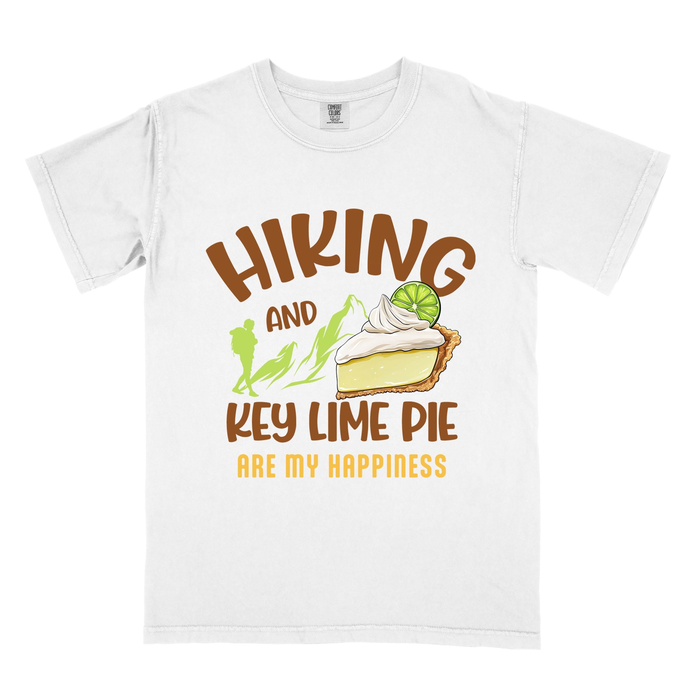 White "Hiking and key lime pie are my happiness" colored vintage tee with bold typography, mountains, birds, illustrated slice of key lime pie, and backpacker for pie lovers.