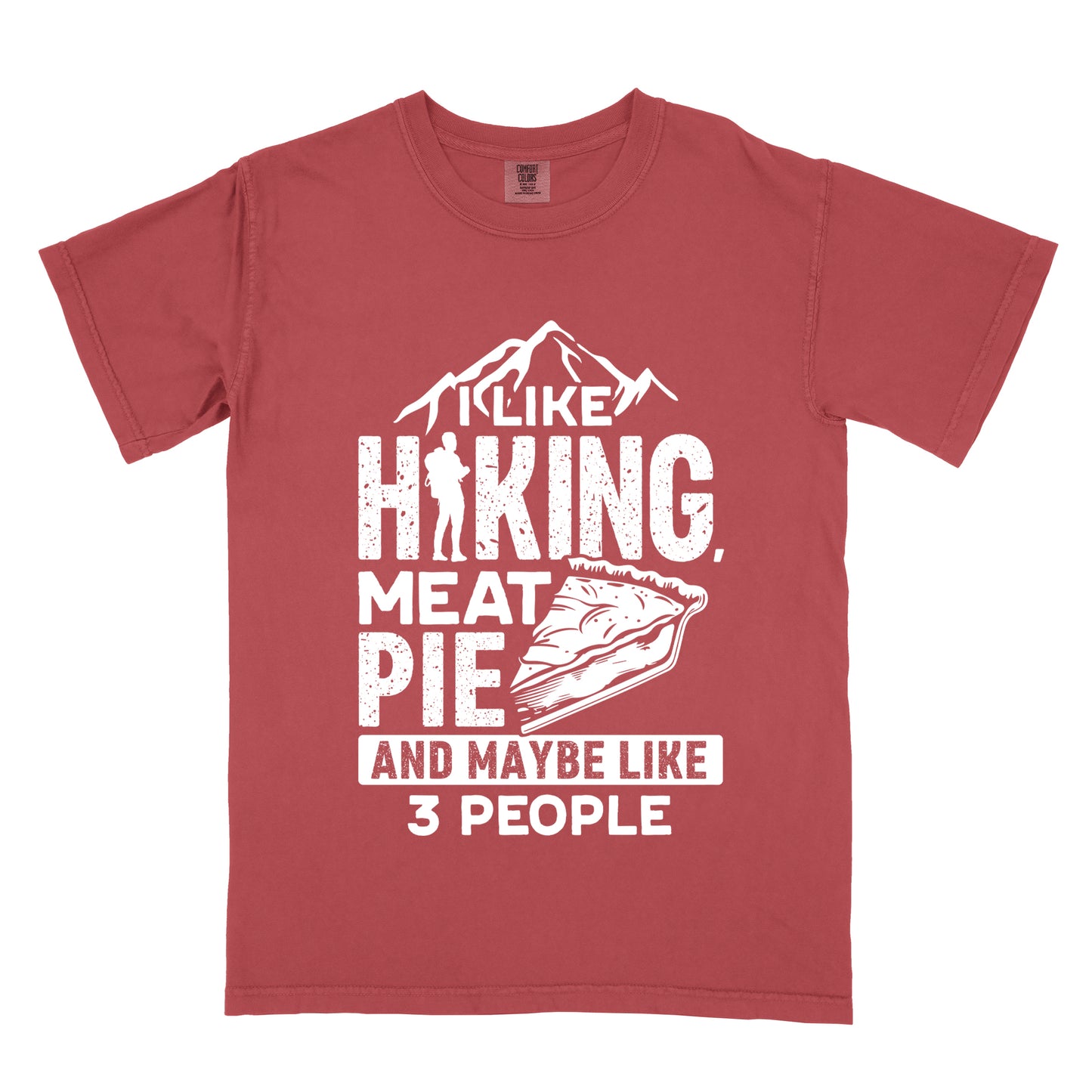 Crimson (Dark Pink) t-shirt with white distressed text reading "I LIKE HIKING, MEAT PIE AND MAYBE LIKE 3 PEOPLE". Mountain silhouettes appear above "I LIKE". The letter "I" in "HIKING" is replaced with a hiker silhouette. Next to "MEAT PIE" is an illustration of a slice of pie. All text and graphics are in white with a weathered, vintage appearance. The design combines outdoor activities, food preferences, and introvert humor.
