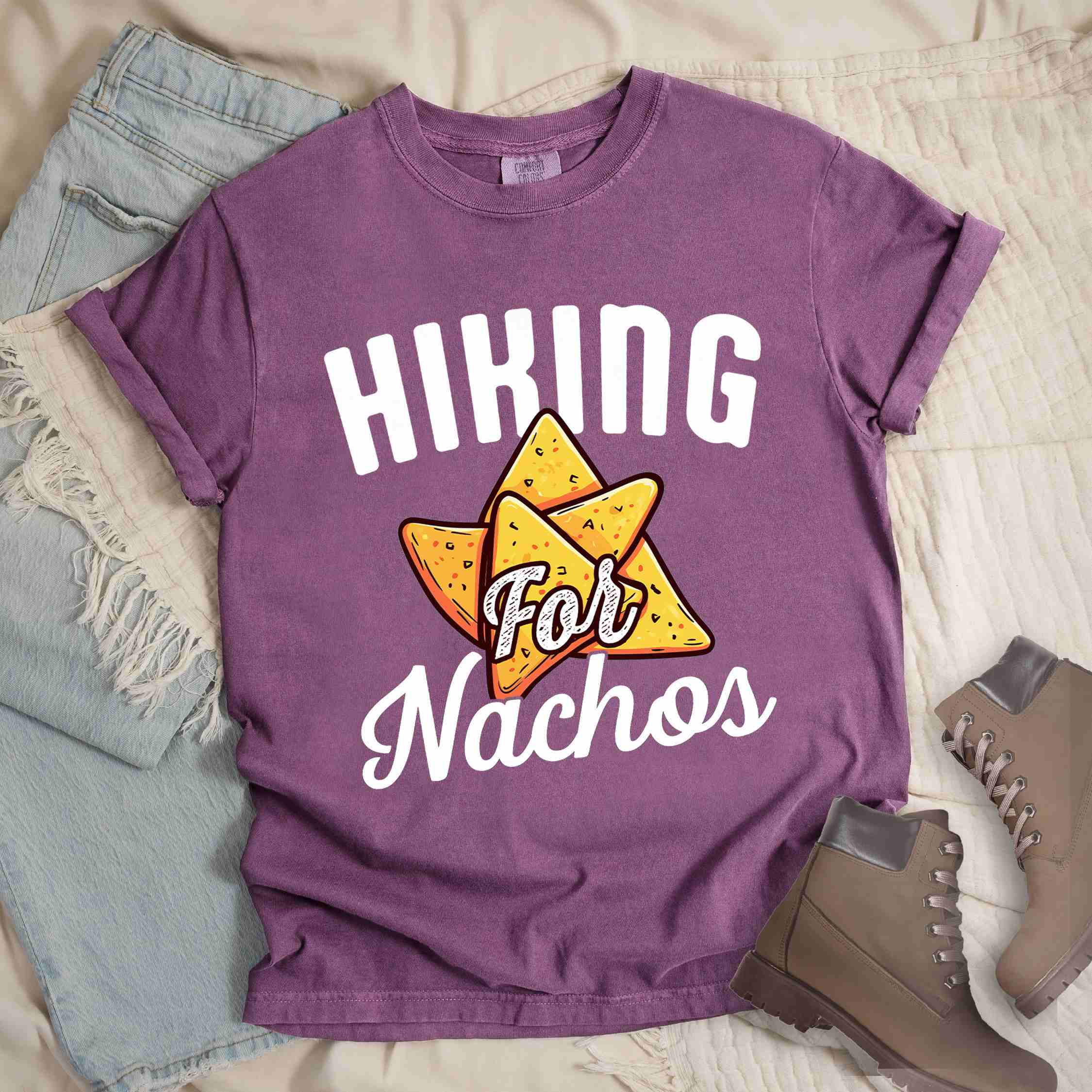 Berry "Hiking for Nachos" colored vintage tee with bold typography, illustrated crispy nachos chips, and backpacker craving for chips.