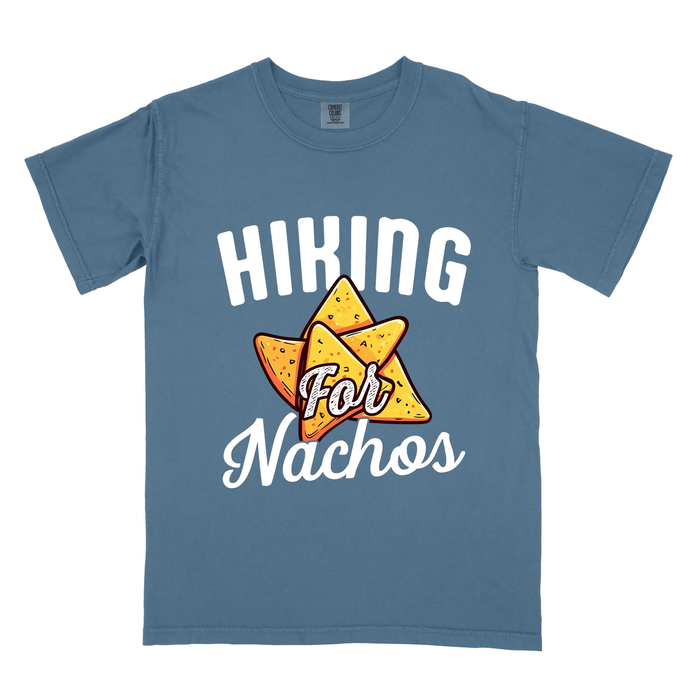 Blue jean "Hiking for Nachos" colored vintage tee with bold typography, illustrated crispy nachos chips, and backpacker craving for chips.