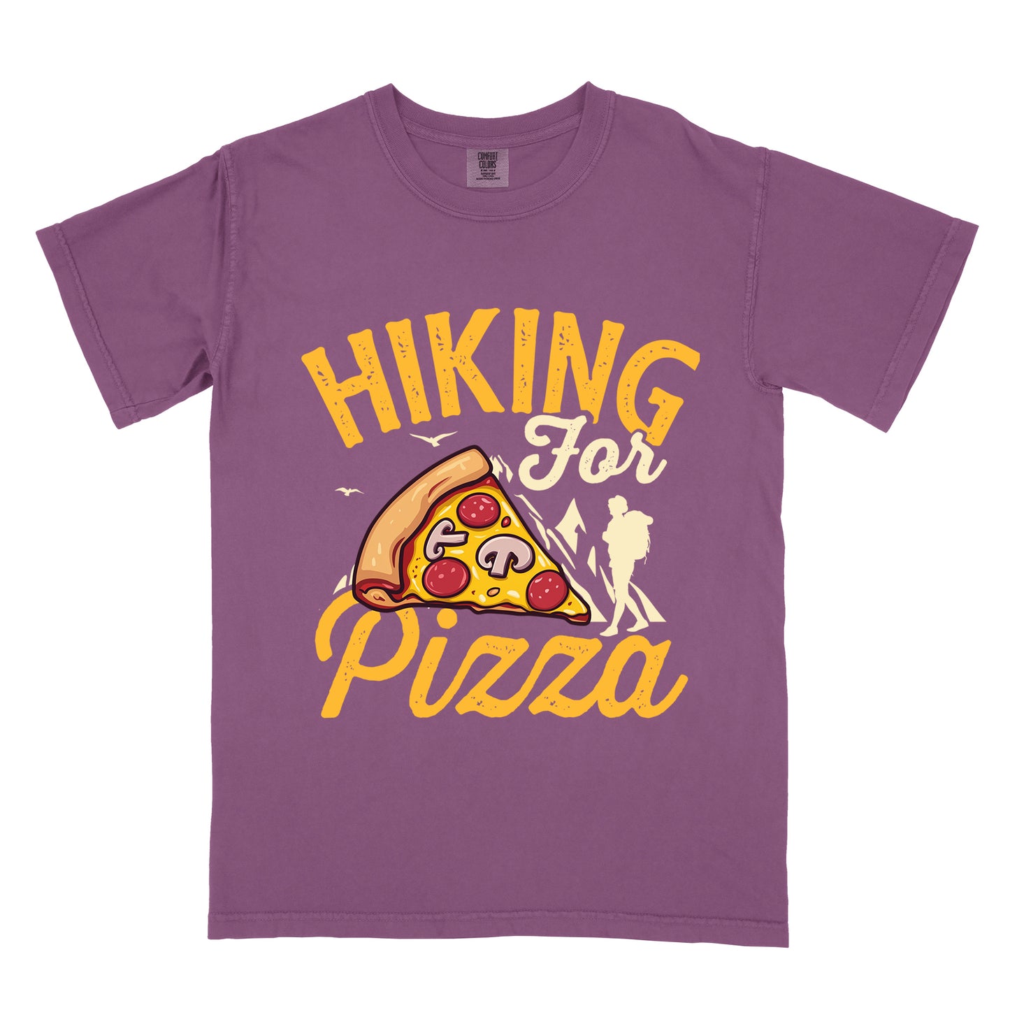 Berry (Dark Violet) t-shirt with yellow distressed text reading "HIKING For Pizza". "HIKING" appears in large yellow letters at the top, "For" in cream script in the middle, and "Pizza" in yellow script at the bottom. Features a detailed pizza slice with pepperoni and mushrooms in the center and a cream silhouette of a hiker on the right side against mountain outlines. Small bird silhouettes appear near the mountains. The design connects hiking activity with food reward.