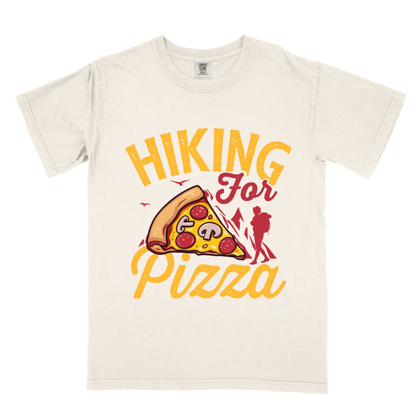 Ivory (Cream White) t-shirt with yellow distressed text reading "HIKING For Pizza". "HIKING" appears in large yellow letters at the top, "For" in red script in the middle, and "Pizza" in yellow script at the bottom. Features a detailed pizza slice with pepperoni and mushrooms in the center and a red silhouette of a hiker on the right side against mountain outlines. Small bird silhouettes appear near the mountains. The design connects hiking activity with food reward.