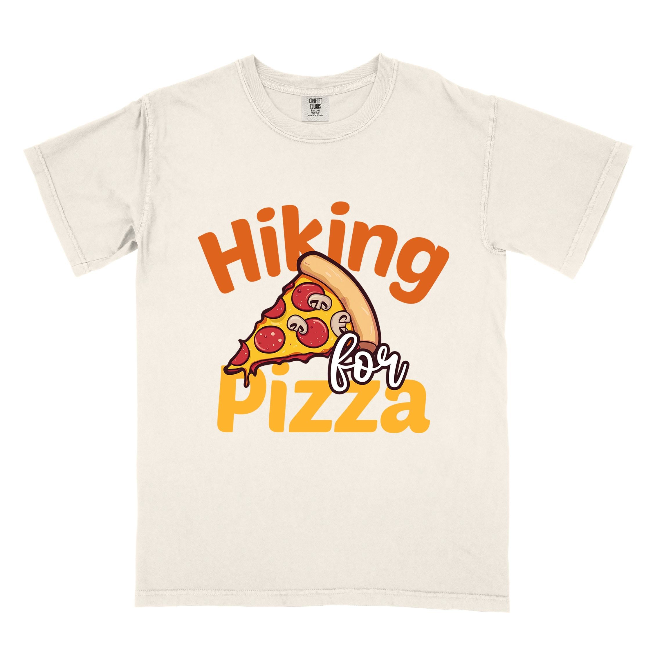Ivory "Hiking for pizza" colored vintage tee with bold typography, illustrated pizza slice, and backpacker for pizza lover.