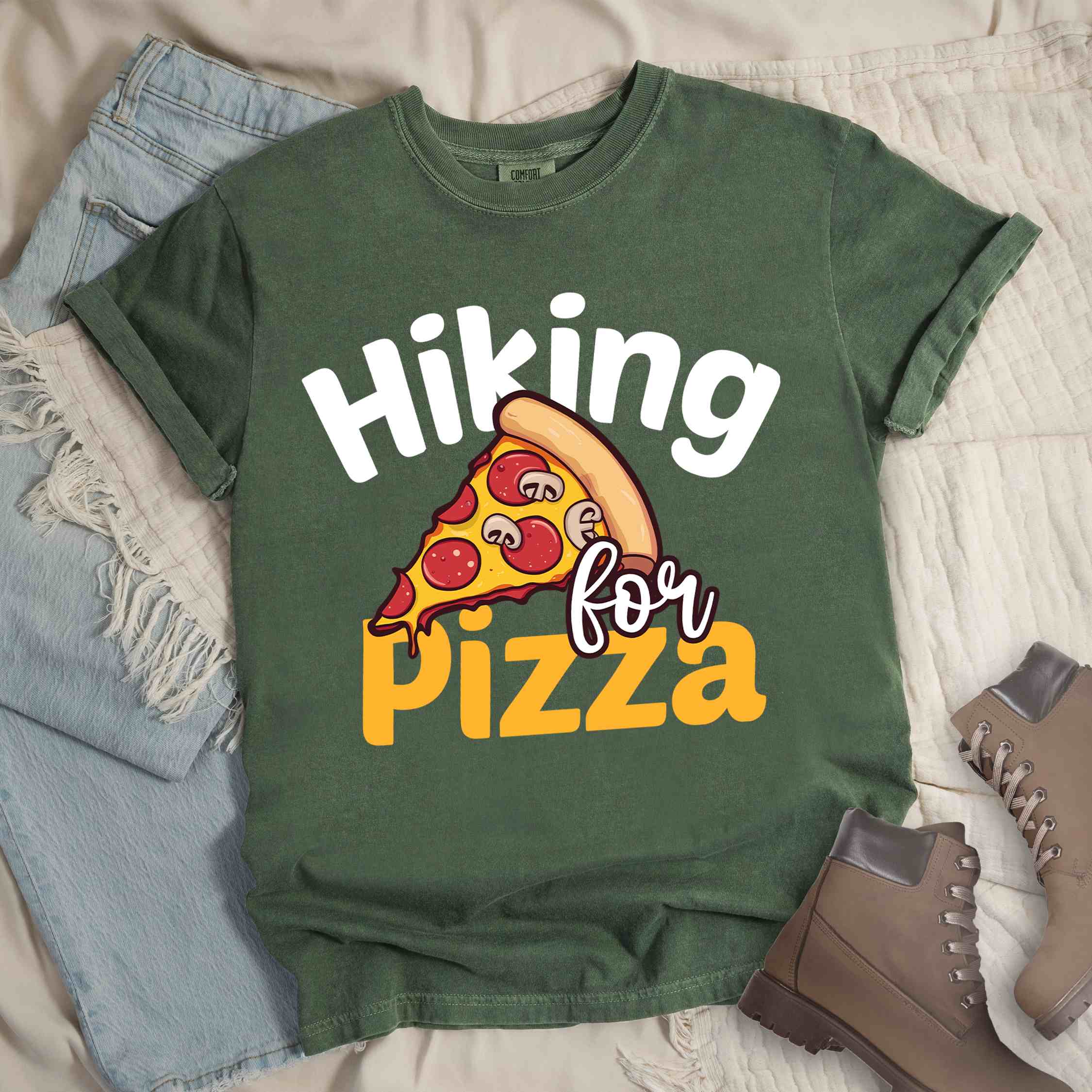 Moss "Hiking for pizza" colored vintage tee with bold typography, illustrated pizza slice, and backpacker for pizza lover.