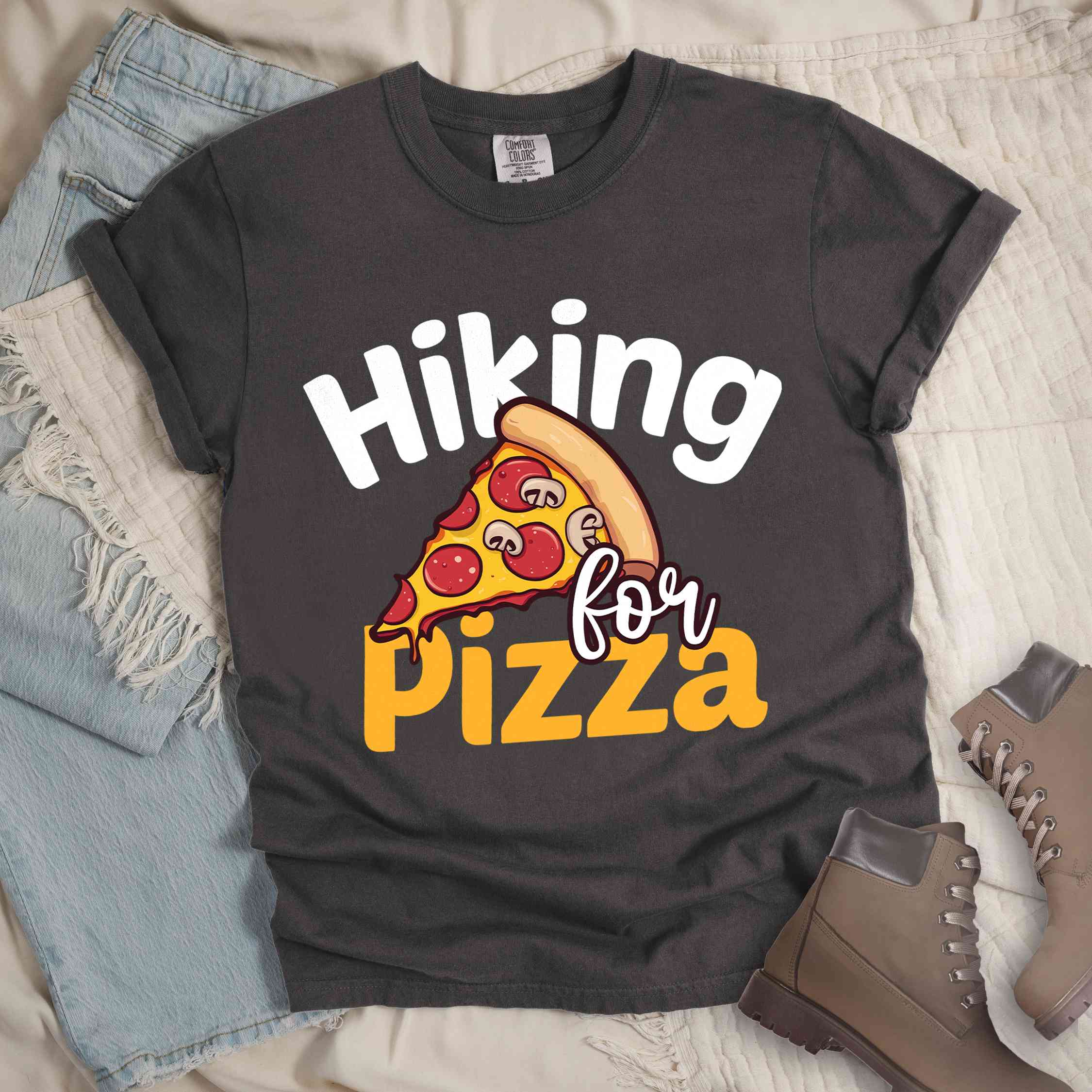 Pepper "Hiking for pizza" colored vintage tee with bold typography, illustrated pizza slice, and backpacker for pizza lover.