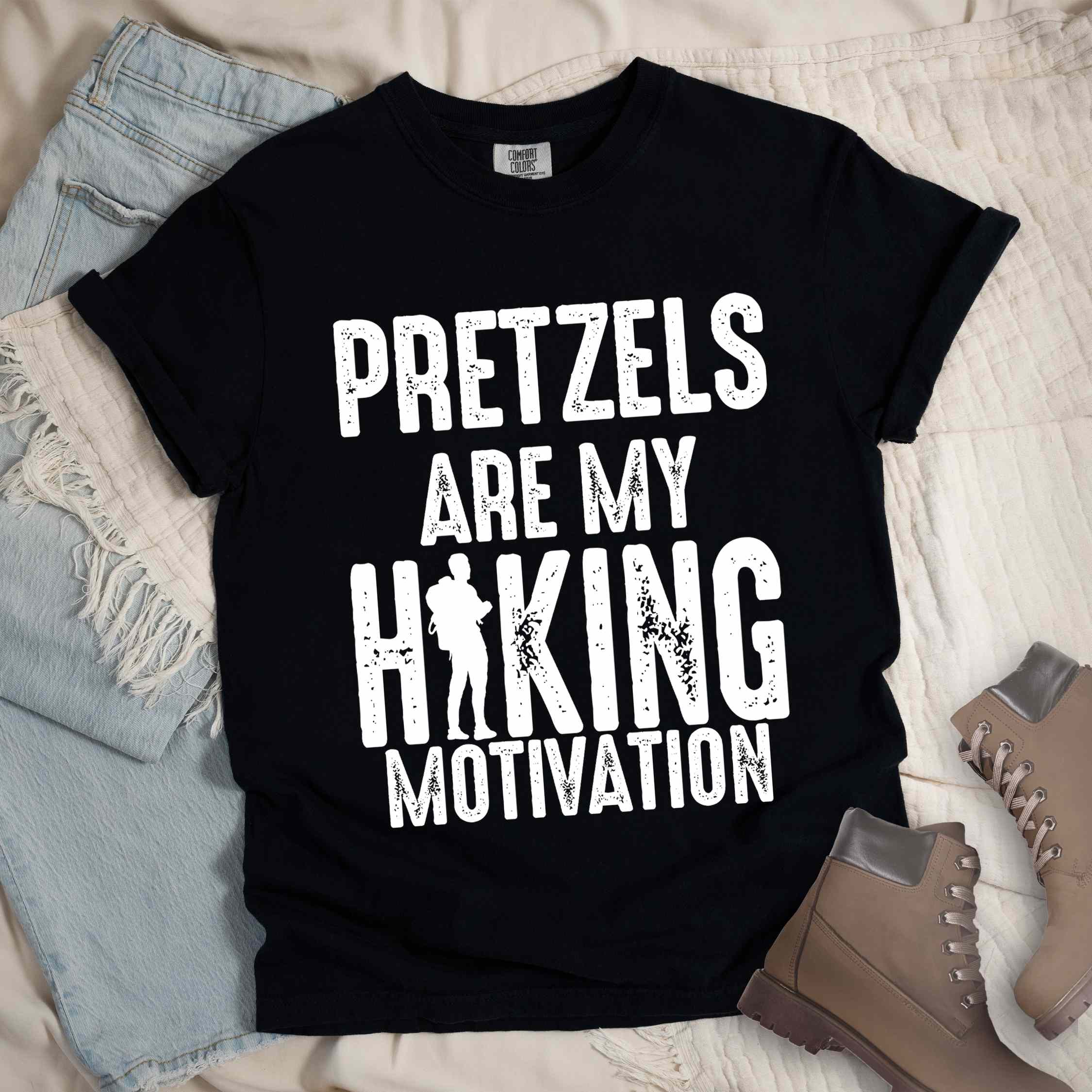 Black "Pretzels are my hiking motivation" colored vintage tee with bold typography, and backpacker for pretzel lovers.