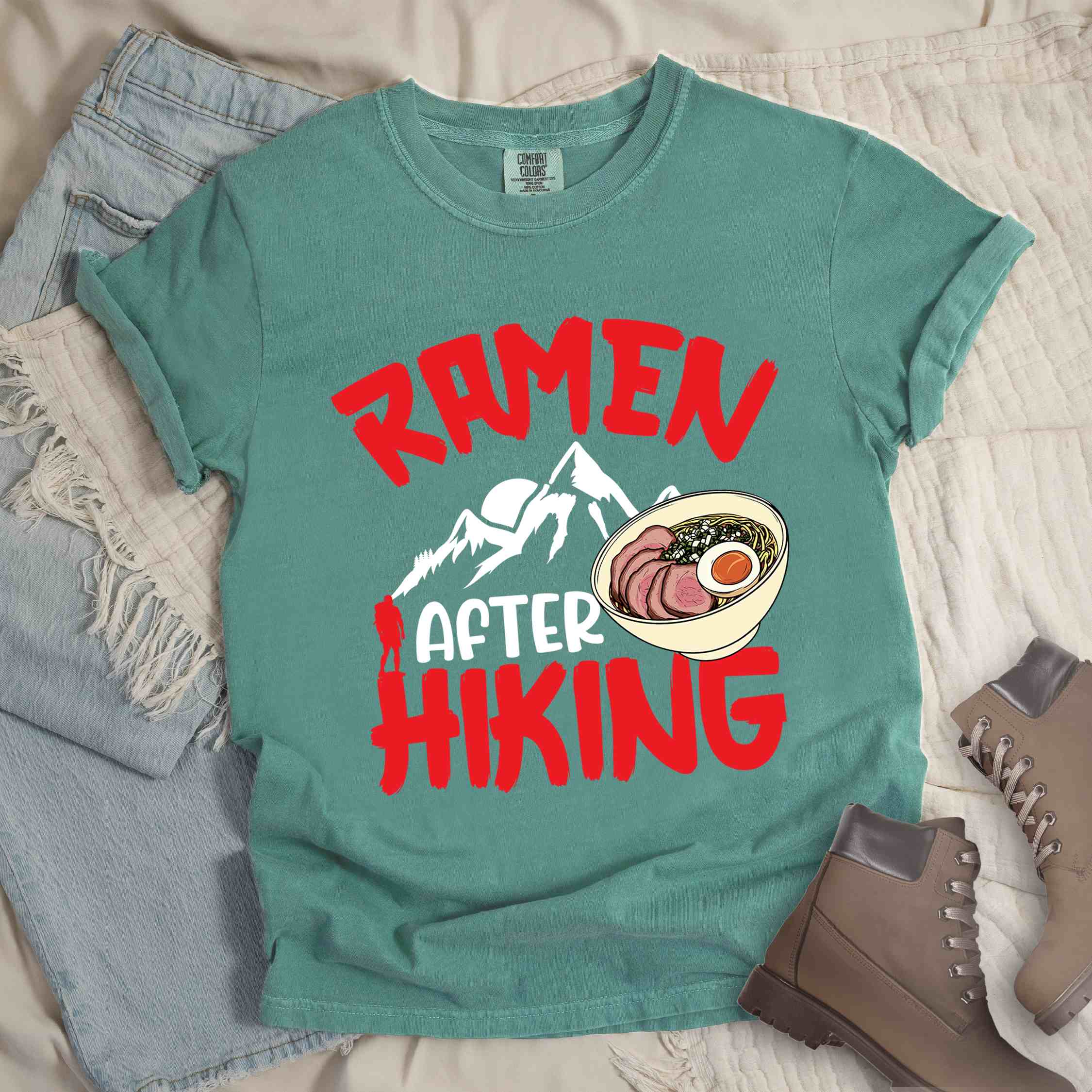 Light green “Ramen after hiking” colored vintage tee with bold text, mountain, Illustration of hot ramen. Perfect tee for a foodie craving for a bowl of ramen
