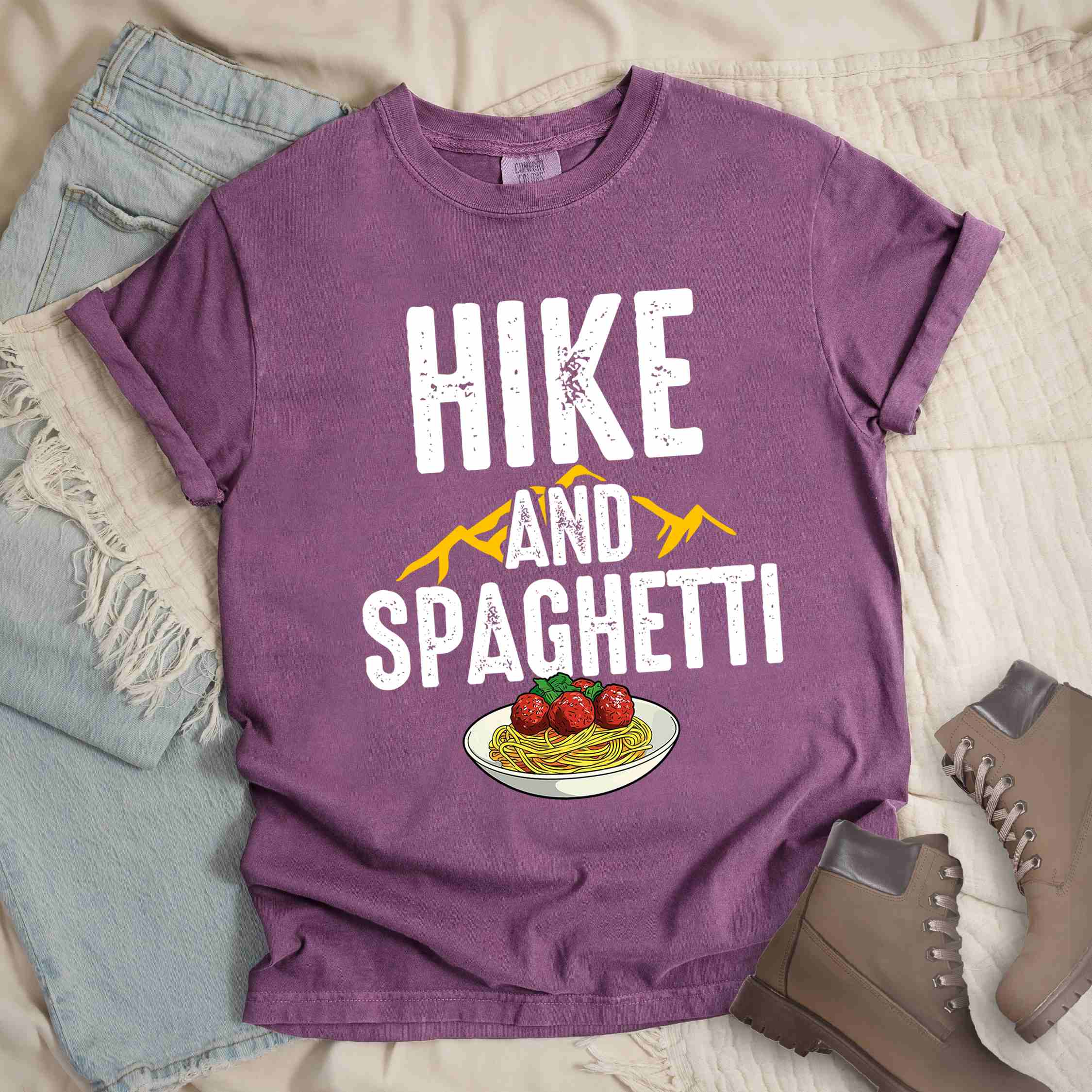 Berry "Hike and Spaghetti" colored vintage tee with bold typography, birds, mountains, illustrated plate of spaghetti and meatballs, and backpacker for pasta lovers.