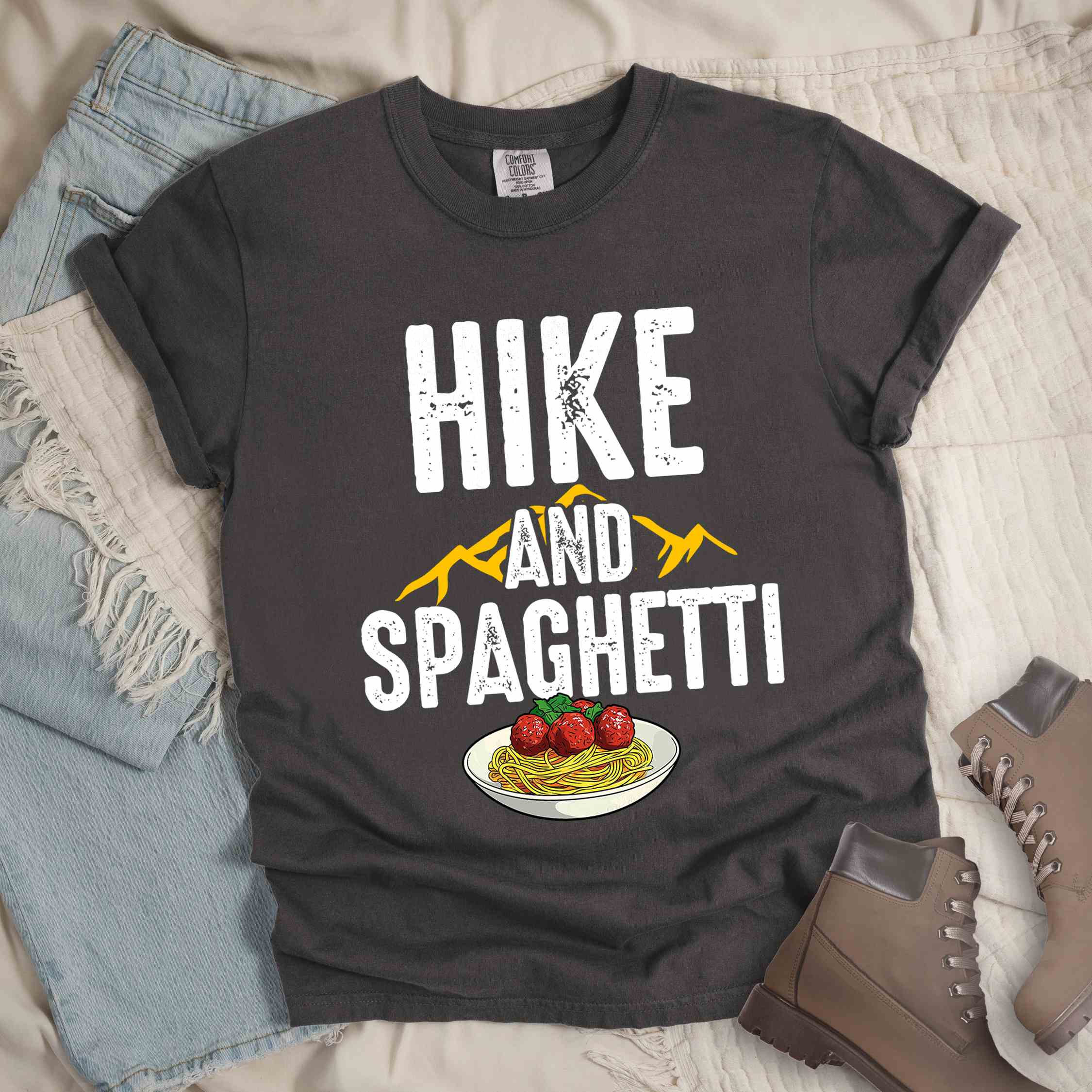 Pepper "Hike and Spaghetti" colored vintage tee with bold typography, birds, mountains, illustrated plate of spaghetti and meatballs, and backpacker for pasta lovers.