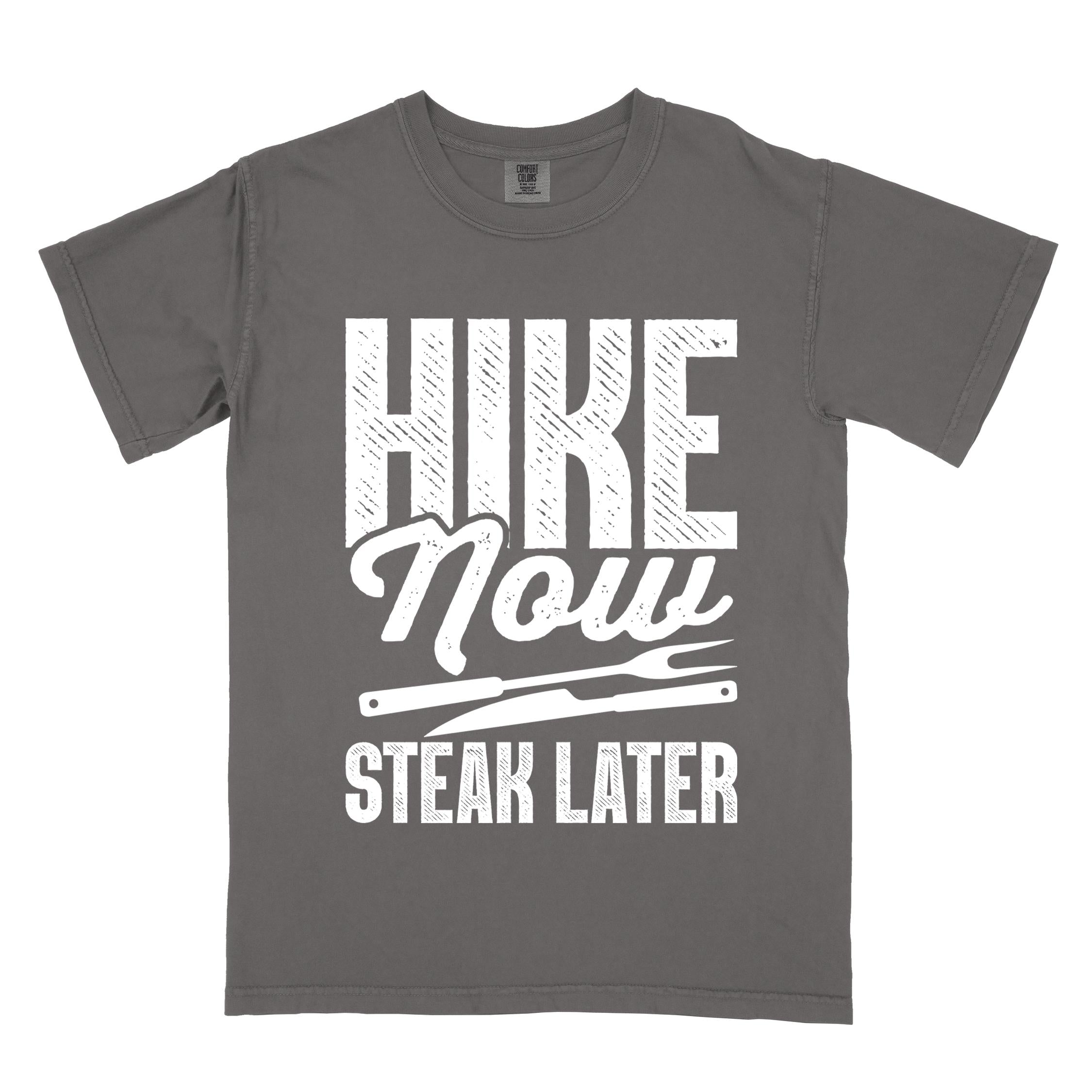 Pepper "Hike now steak later" colored vintage tee with bold typography, illustrated steak utensils, and backpacker for steak lovers.