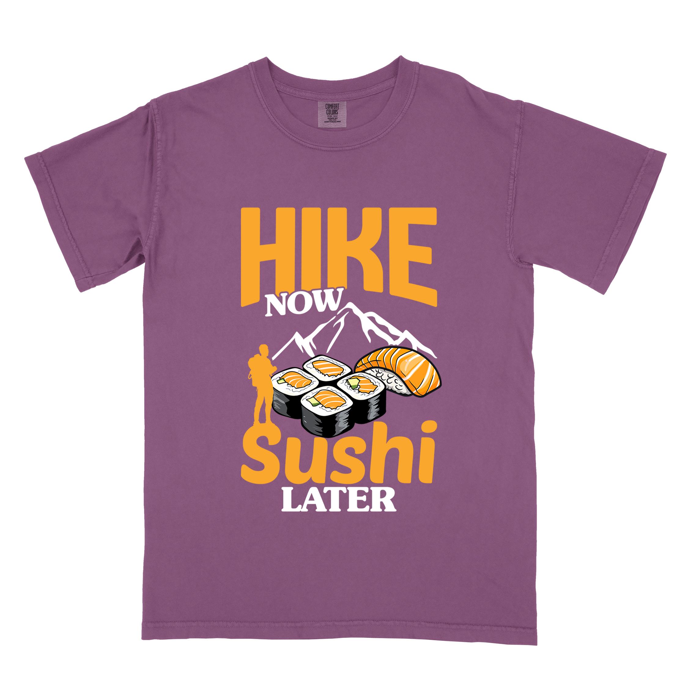 Berry "Hike now sushi later" colored vintage tee with bold typography, birds, mountains, illustrated sushi platter, and backpacker for sushi lovers.