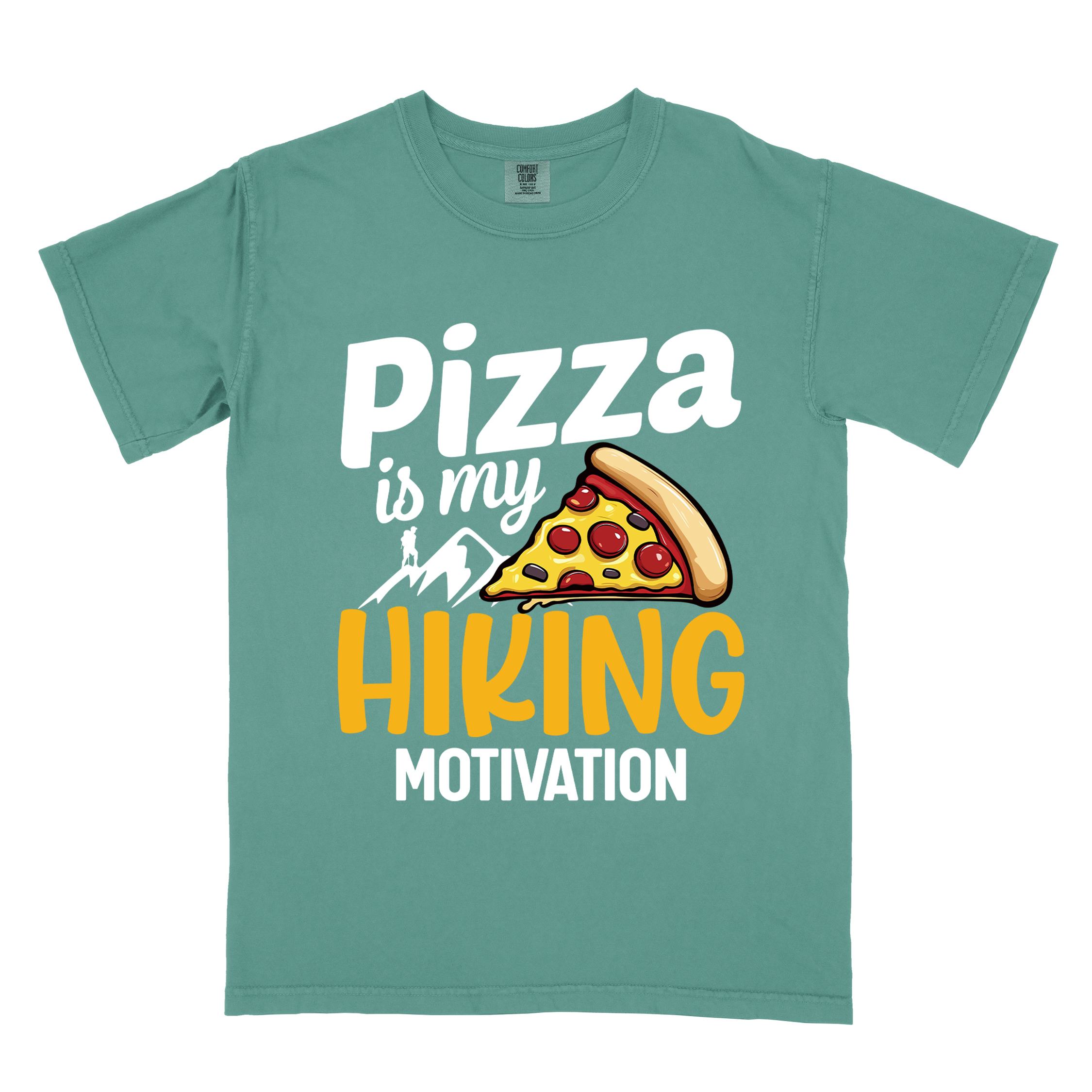 Light green "Pizza is my hiking motivation" colored vintage tee with bold typography, birds, mountains, illustrated pizza slice, and backpacker for pizza lovers.