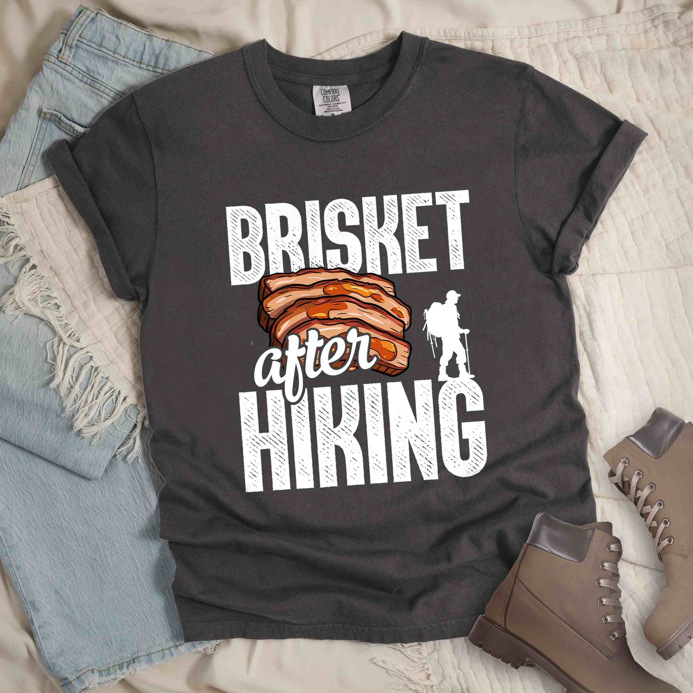 Pepper "Brisket after hiking" colored vintage tee with bold typography, birds, mountains, illustrated bbq beef brisket, and backpacker for bbq lovers.