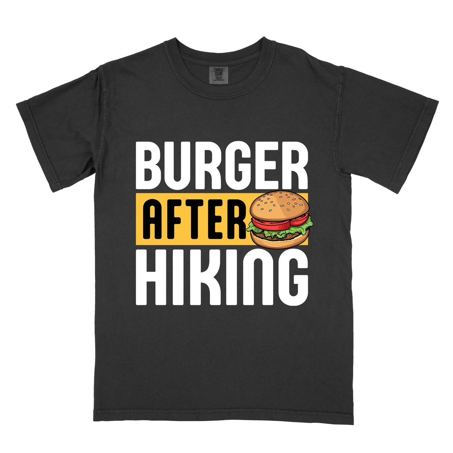 Black t-shirt with bold text reading "BURGER AFTER HIKING". "BURGER" appears in large white letters at the top, "AFTER" in black text on a yellow rectangular background in the middle, and "HIKING" in large white letters at the bottom. Features a detailed illustration of a hamburger with sesame seed bun, lettuce, tomato and patty next to the word "AFTER". 