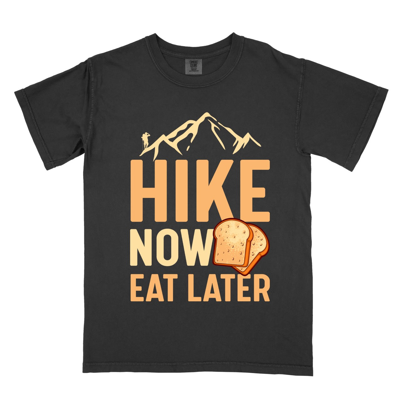 Black Food motivation vintage tee Hike Now Eat Later with mountain peak range character silhouette bold typography and illustrated toast slices on Comfort Colors shirt for delayed gratification adventure enthusiasts, food lovers and hikers.