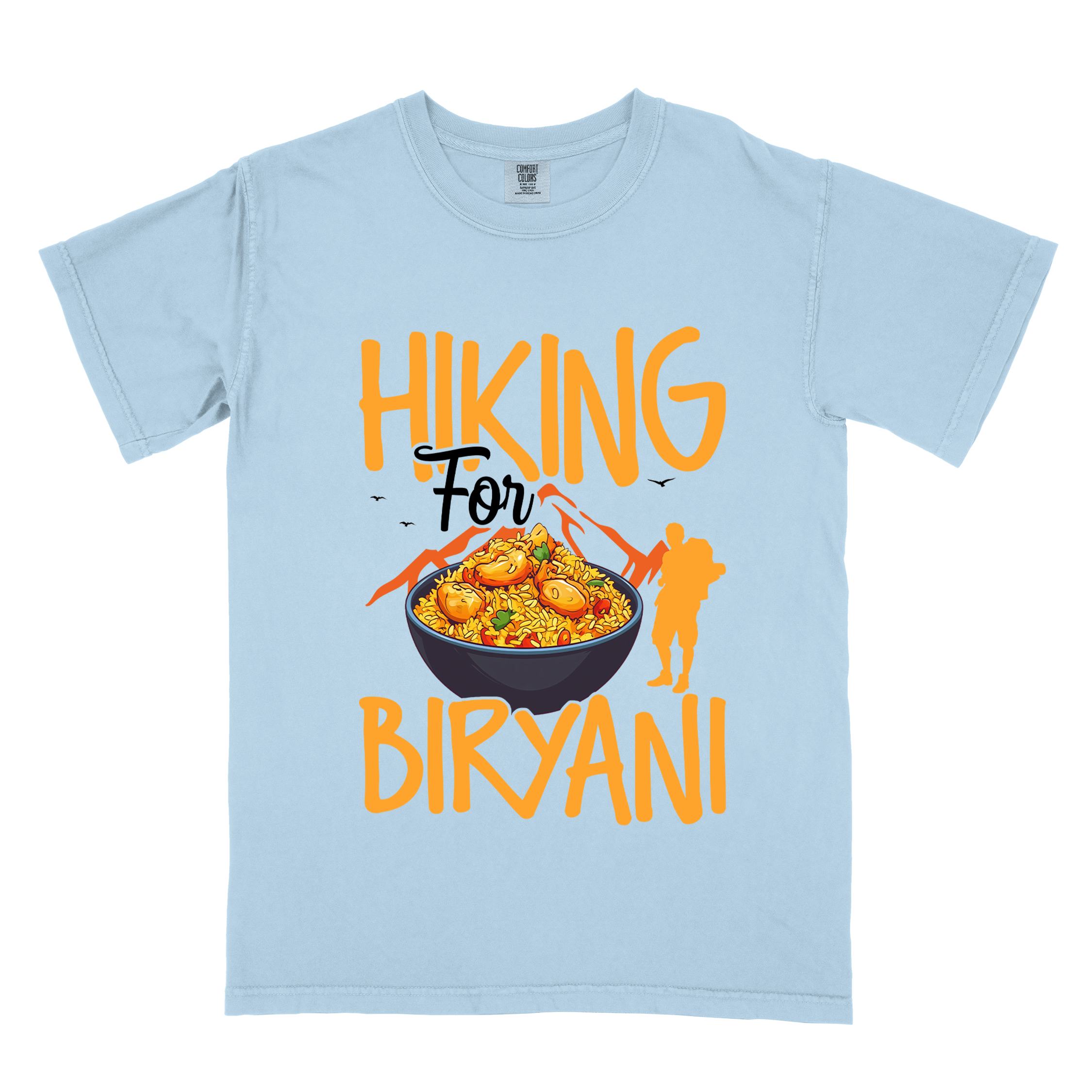 Chambray "Hiking for Biryani" colored vintage tee with bold typography, birds, mountains, illustrated bowl of biryani rice, and backpacker for rice lovers.