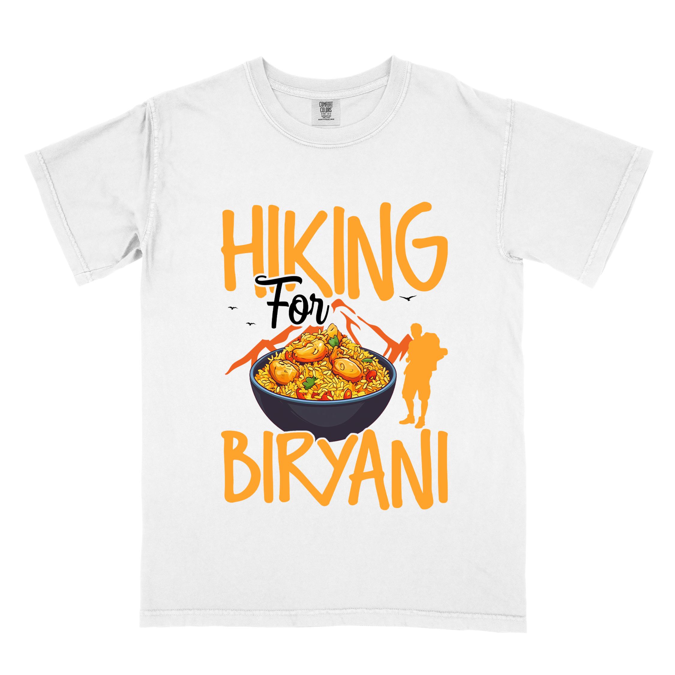 White "Hiking for Biryani" colored vintage tee with bold typography, birds, mountains, illustrated bowl of biryani rice, and backpacker for rice lovers.