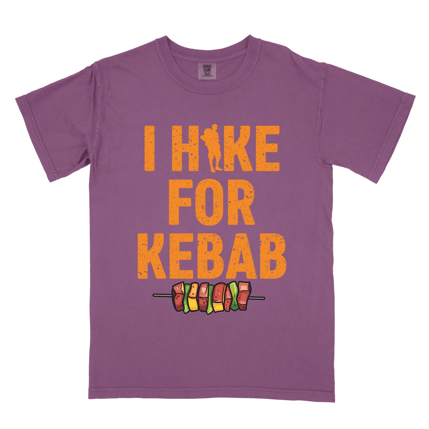 Berry (Dark Violet) t-shirt with orange distressed text reading "I HIKE FOR KEBAB". "I HIKE" appears at the top with a hiker silhouette integrated into the letter "I", "FOR" in the middle, and "KEBAB" at the bottom. Below the text is a colorful illustration of a kebab skewer with meat and vegetables.