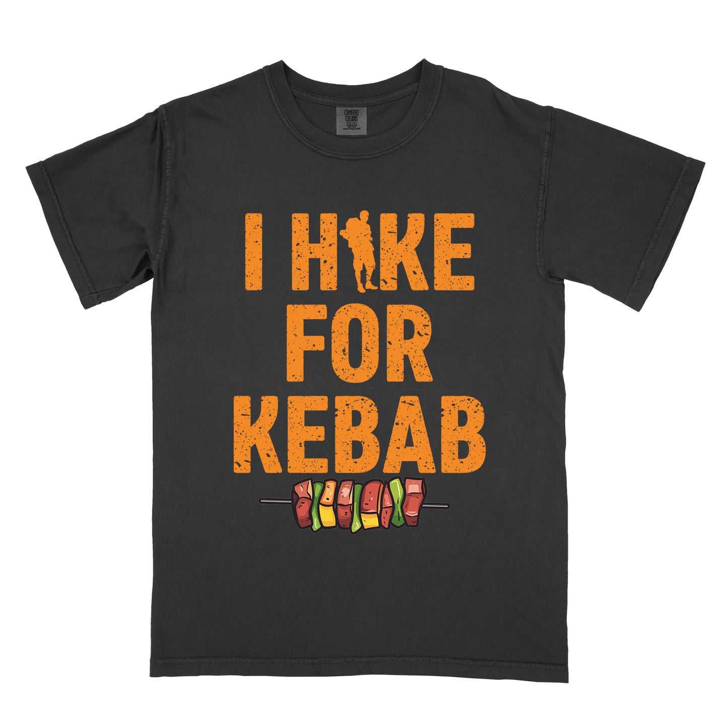 Black t-shirt with orange distressed text reading "I HIKE FOR KEBAB". "I HIKE" appears at the top with a hiker silhouette integrated into the letter "I", "FOR" in the middle, and "KEBAB" at the bottom. Below the text is a colorful illustration of a kebab skewer with meat and vegetables.