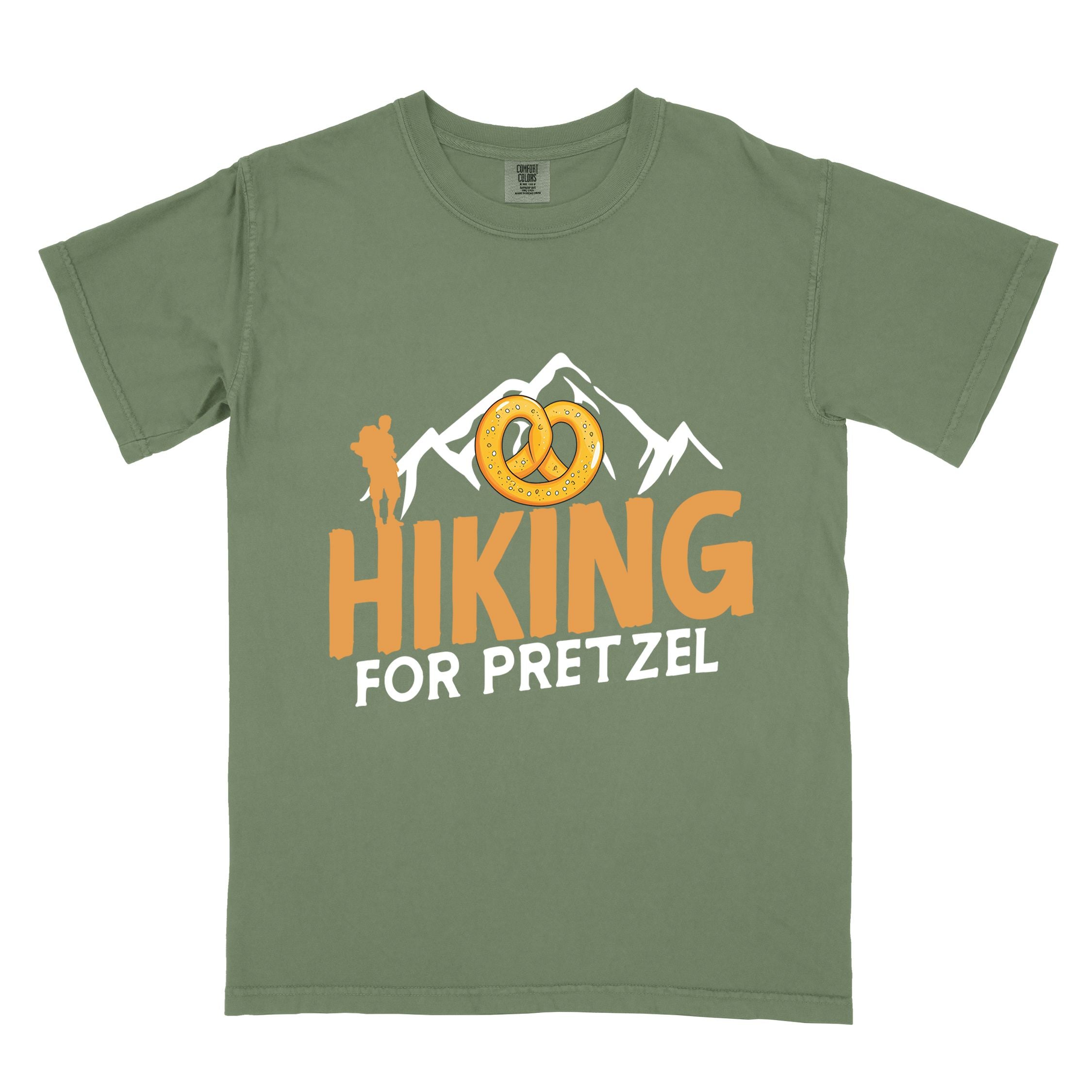 Moss "Hiking for pretzel" colored vintage tee with bold typography, mountains, birds, and illustrated pretzel for baked pretzel lovers