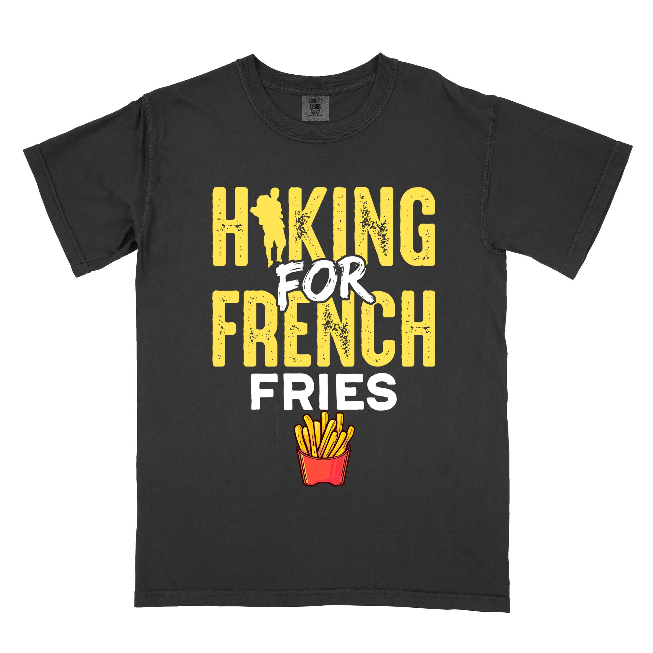 Black "Hiking for french fries" colored vintage tee with bold typography, mountains, illustrated fries, and backpacker for comfort food enthusiasts.