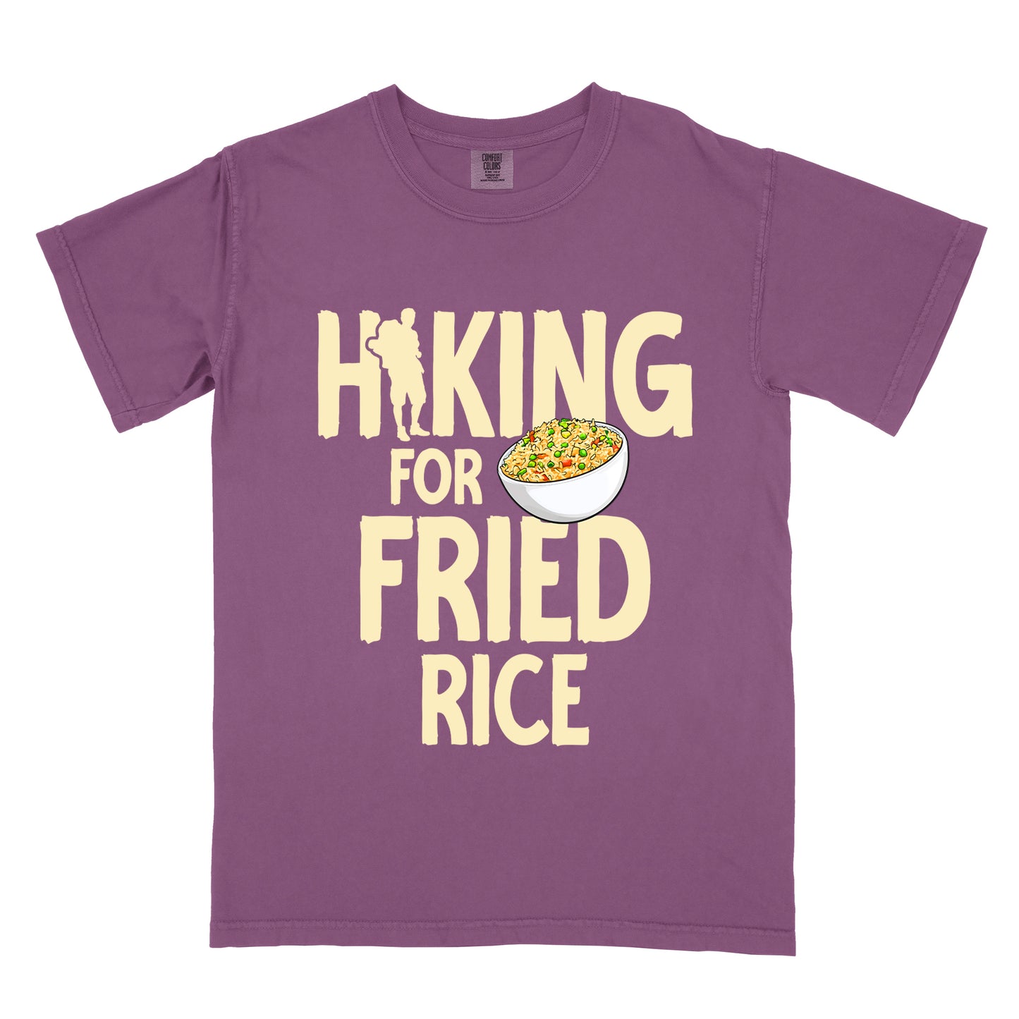 Berry (Dark Violet) t-shirt with pale yellow text reading "HIKING FOR FRIED RICE". "HIKING" appears at the top with a hiker silhouette integrated into the letter "I", "FOR" in smaller text in the middle, and "FRIED RICE" in large letters at the bottom. Features an illustration of a white bowl filled with colorful fried rice with vegetables next to "FOR" and above "FRIED".