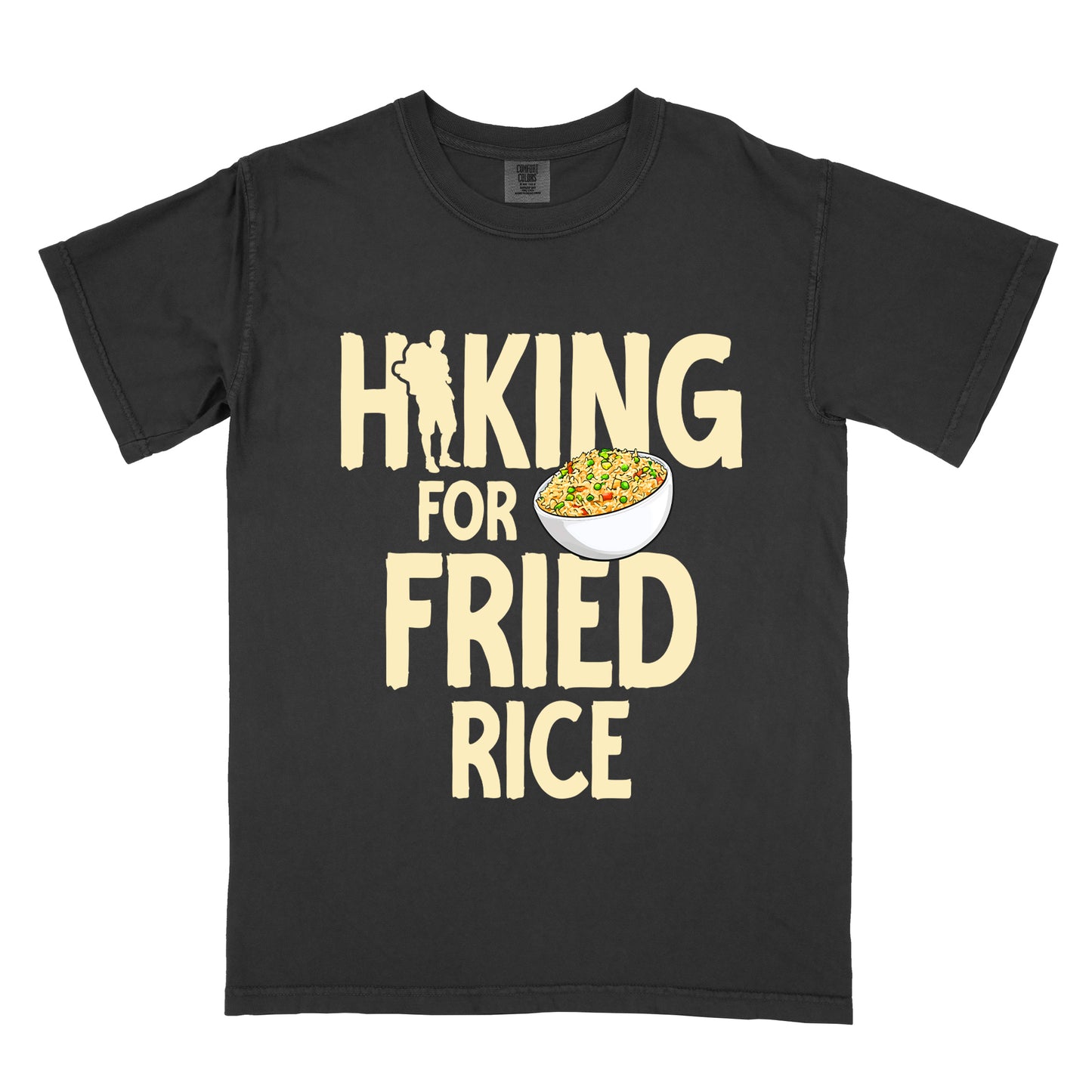 Black t-shirt with pale yellow text reading "HIKING FOR FRIED RICE". "HIKING" appears at the top with a hiker silhouette integrated into the letter "I", "FOR" in smaller text in the middle, and "FRIED RICE" in large letters at the bottom. Features an illustration of a white bowl filled with colorful fried rice with vegetables next to "FOR" and above "FRIED".