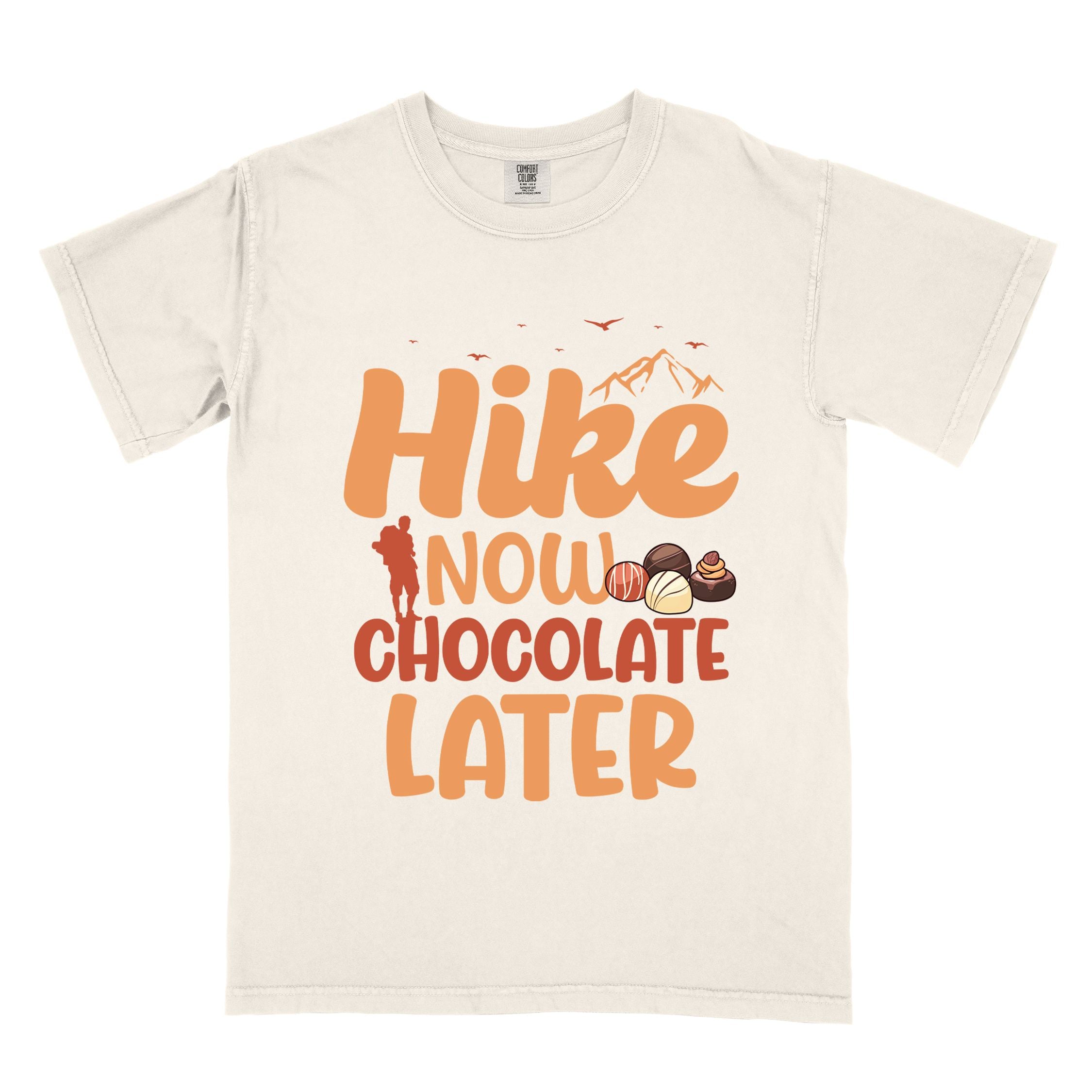 Ivory "Hike now chocolate later" colored vintage tee with bold typography, mountains, illustrated a serving of Tiramisu, and perfect for chocolate lovers.