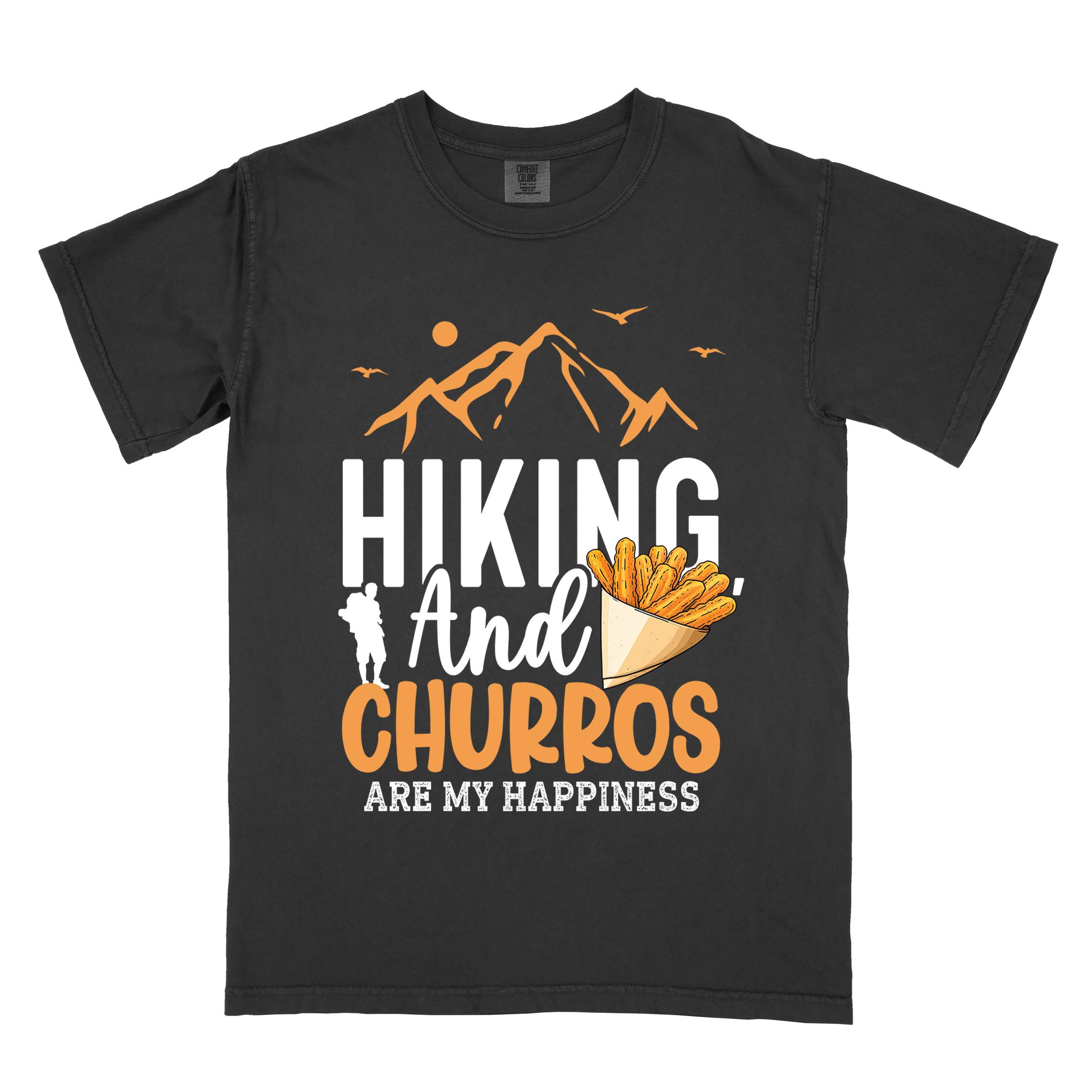 black "hiking and churros are my happiness " colored vintage tee with bold typography, mountains, birds, illustrated a serving of Churros, and backpackers with a sweet tooth.