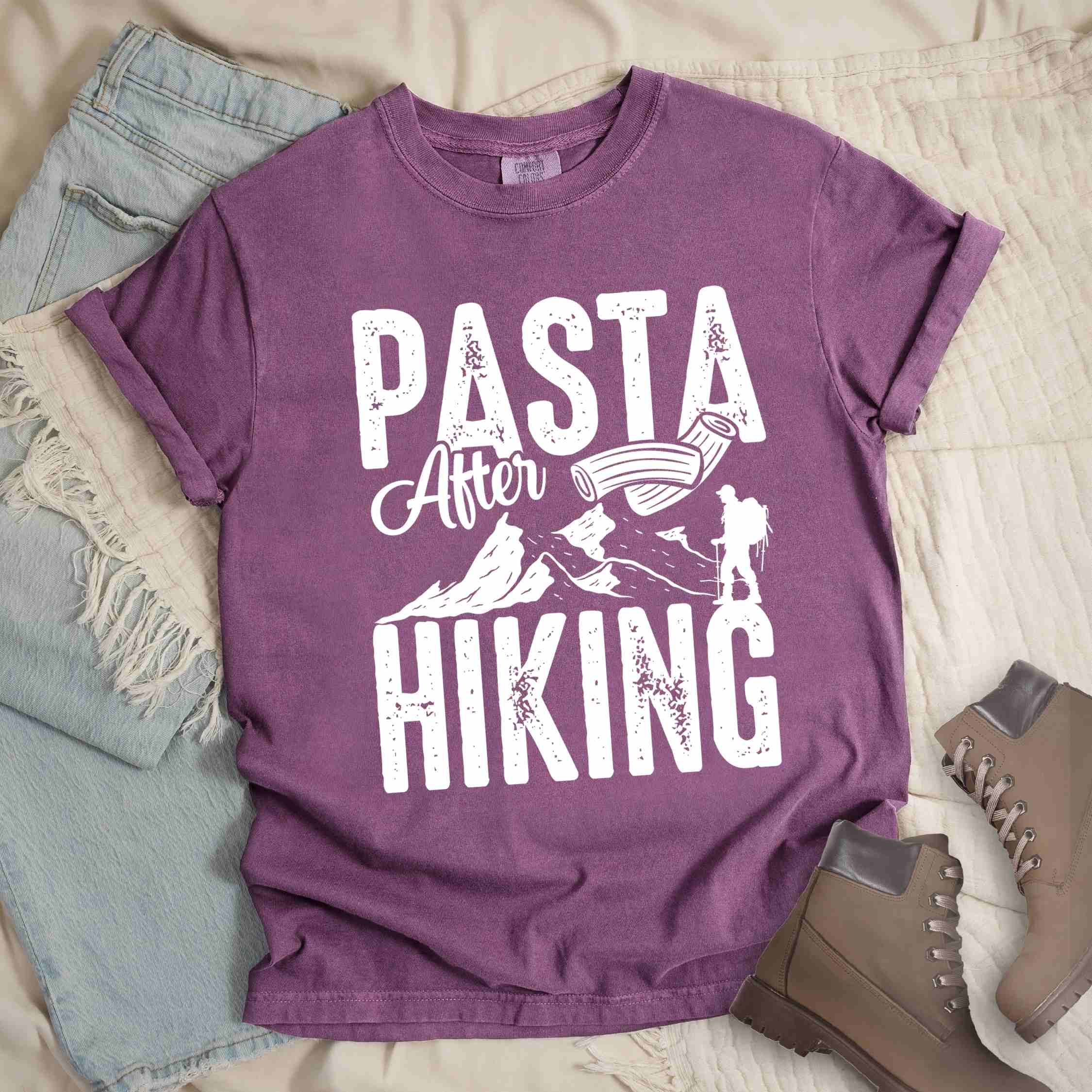 Berry "Pasta after hiking" colored vintage tee with bold typography, birds, mountains, illustrated pieces of pasta, and backpackers for pasta lovers.