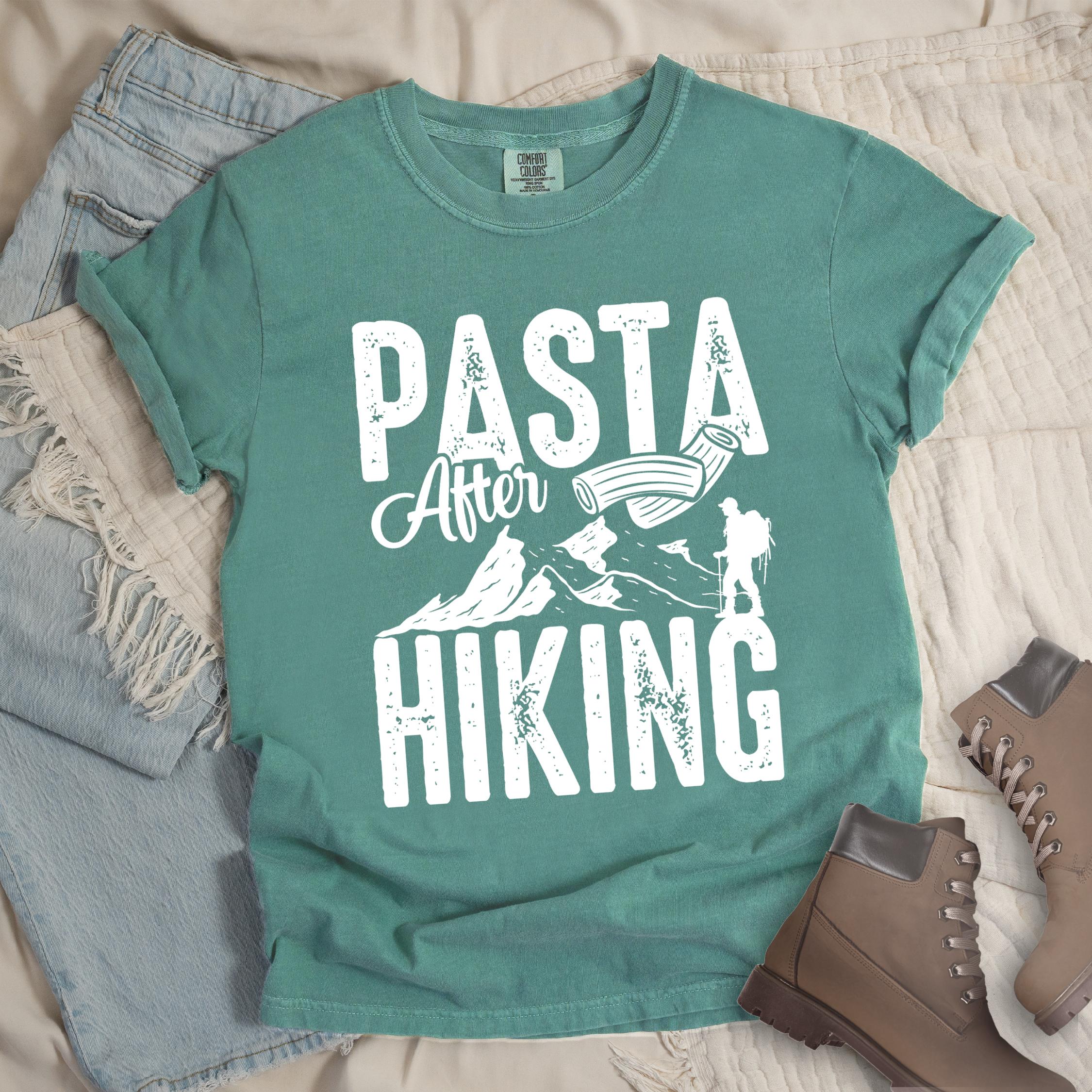 Green shirt with the phrase “Pasta After Hiking.” Includes a hiker silhouette, mountain outline, and pasta noodle illustration.