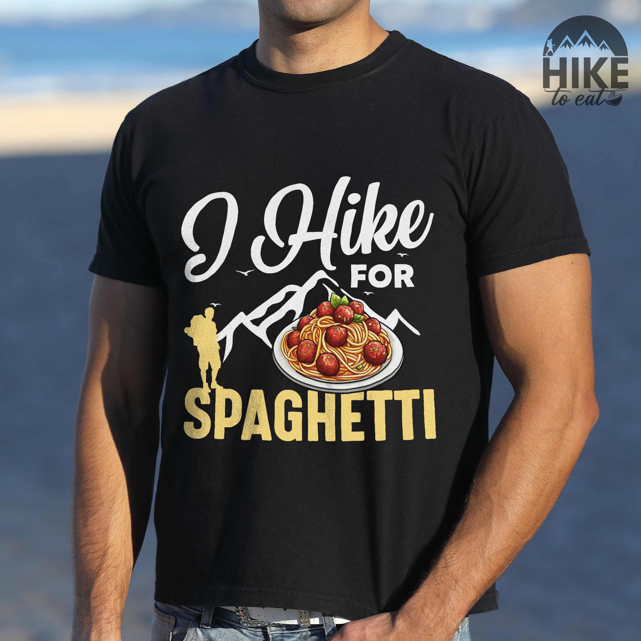 Man wearing black "I hike for spaghetti" colored vintage tee with bold typography, illustrated plate of spaghetti meatballs, and backpackers for pasta lovers.