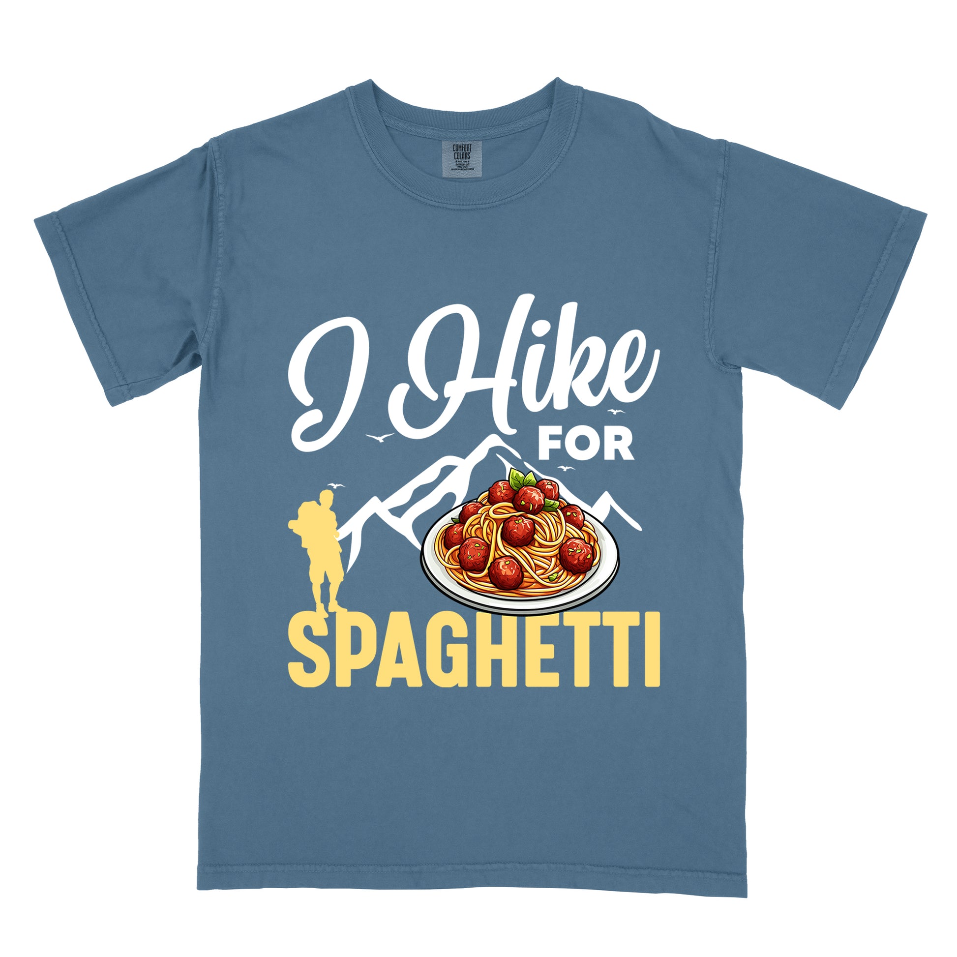 Blue Jean (Denim Blue) t-shirt with white and yellow text reading "I Hike FOR SPAGHETTI". "I Hike" appears in white script at the top, "FOR" in white uppercase text, and "SPAGHETTI" in large yellow letters at the bottom. Features white mountain silhouettes with small birds, a yellow hiker silhouette on the left, and a detailed illustration of spaghetti with meatballs and basil on a white plate.