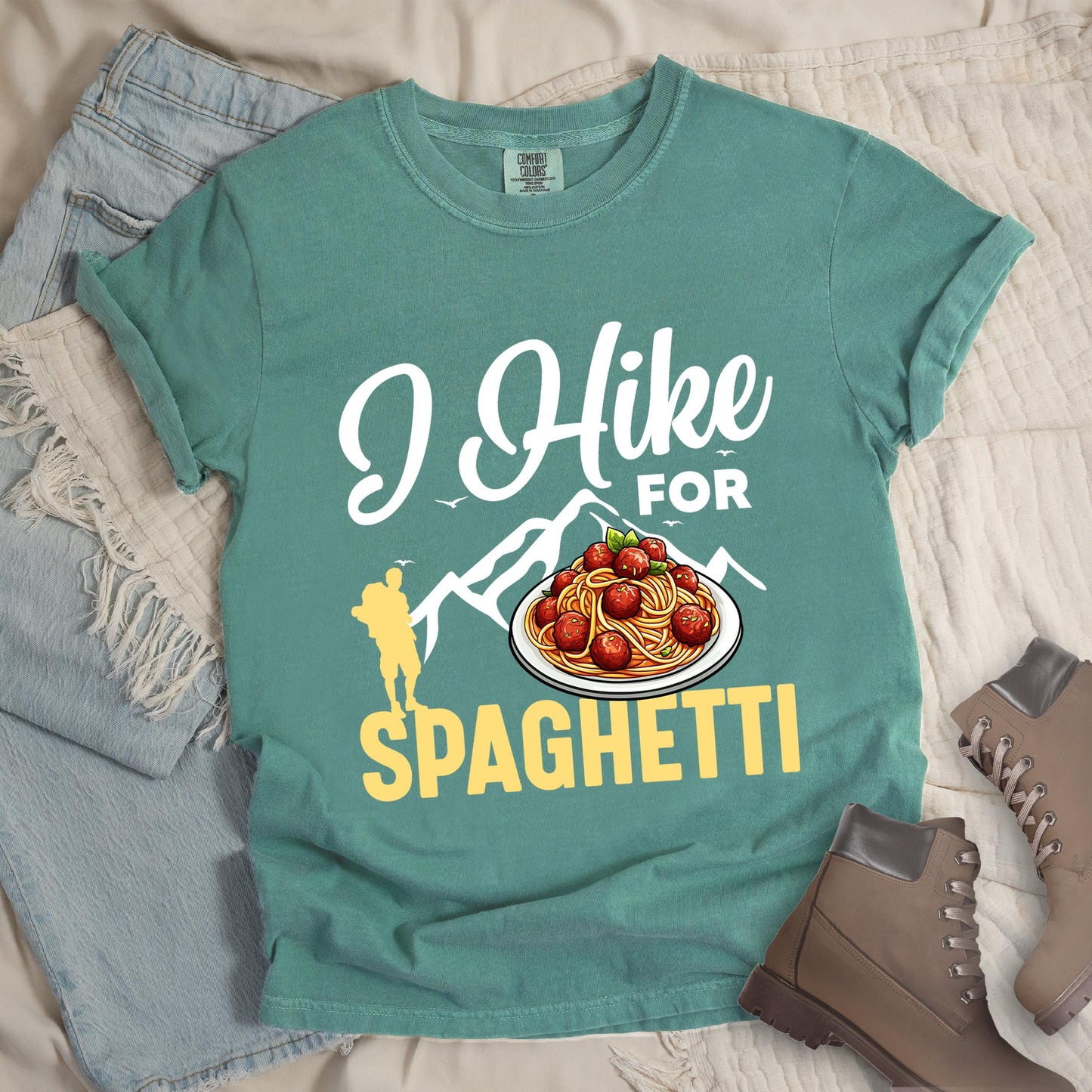 Green shirt with the phrase “I Hike For Spaghetti.” Includes a hiker silhouette, mountain outline, and a plate of spaghetti with meatballs.