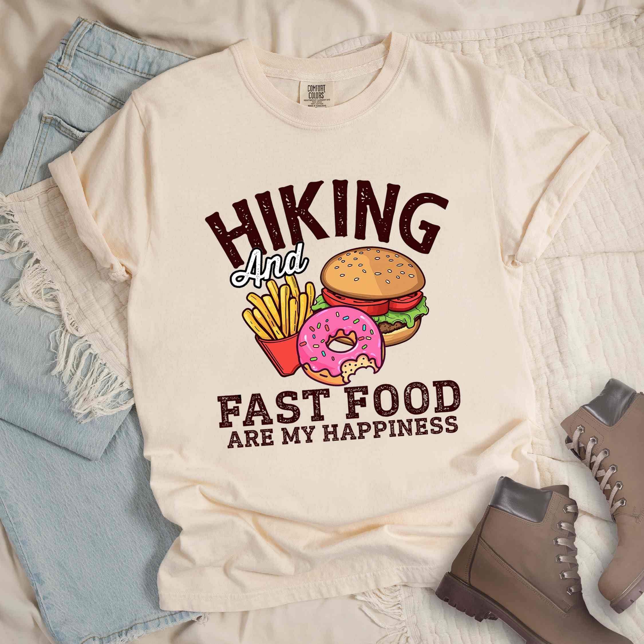 Ivory "Hiking and Fast Food are my Happiness" colored vintage tee with bold typography, and illustrated fast food meal for the hikers who wants a rewarding meal.