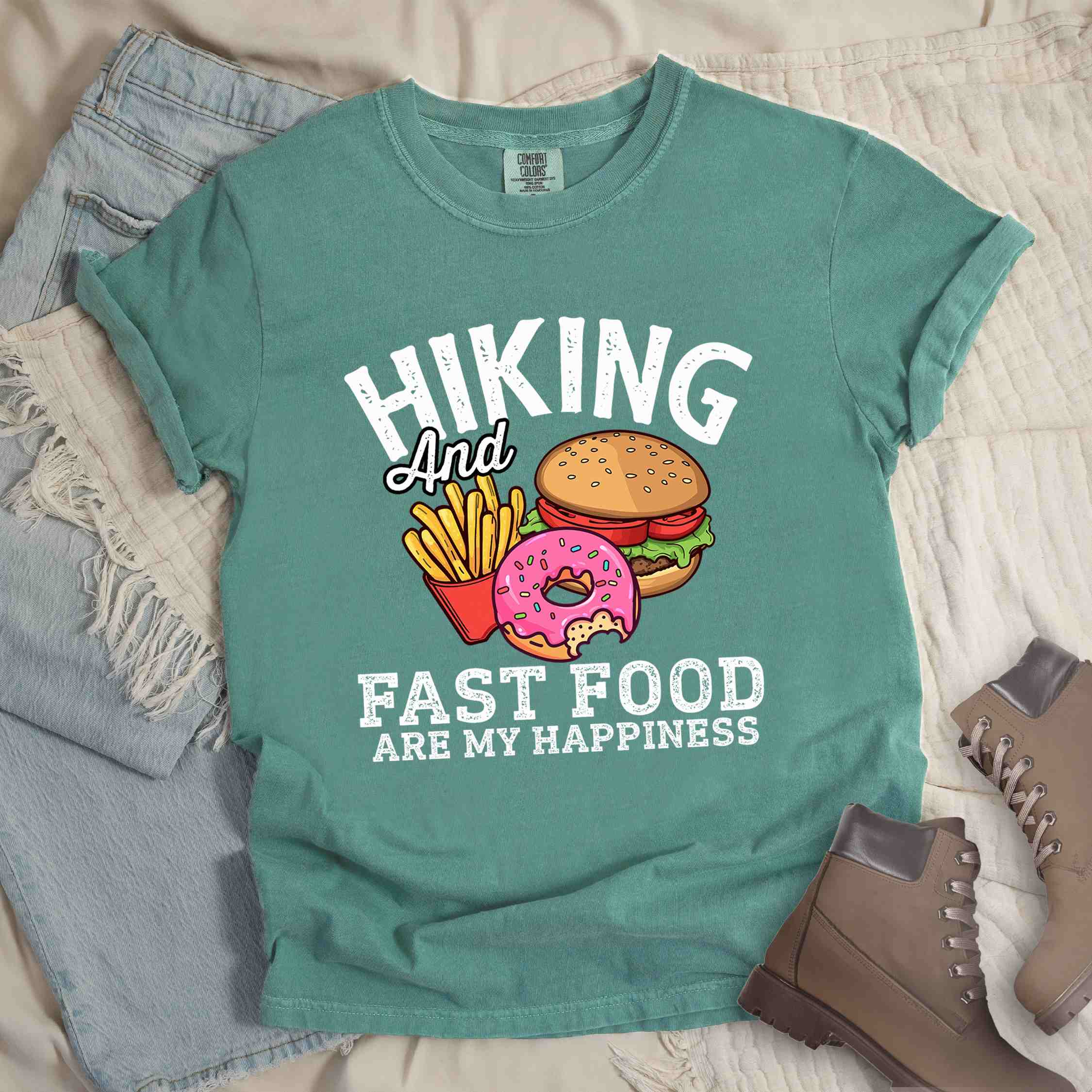 Light green "Hiking and Fast Food are my Happiness" colored vintage tee with bold typography, and illustrated fast food meal for the hikers who wants a rewarding meal.